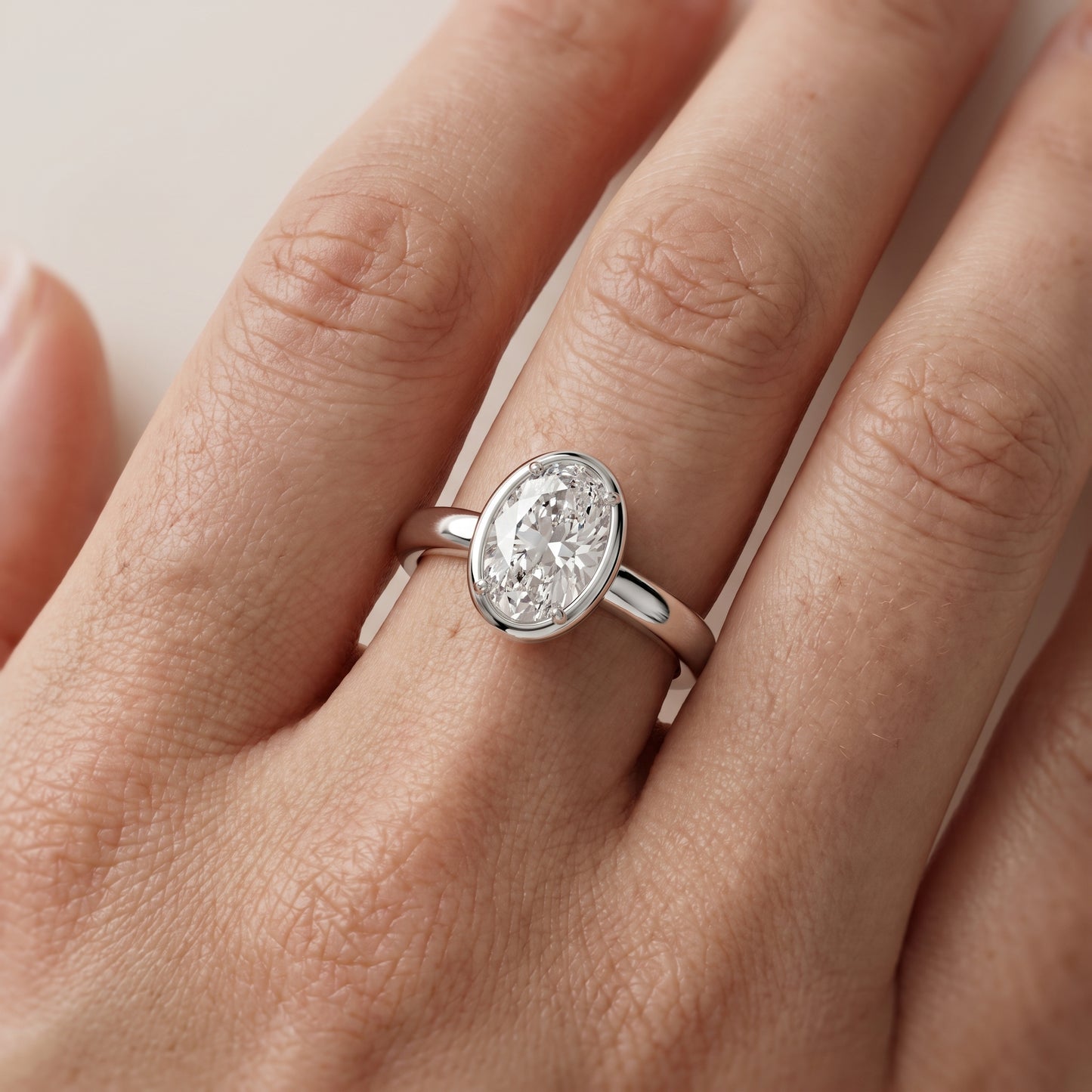Alina Bezel Solitaire Oval Diamond Ring in Platinum - lifestyle.jpg