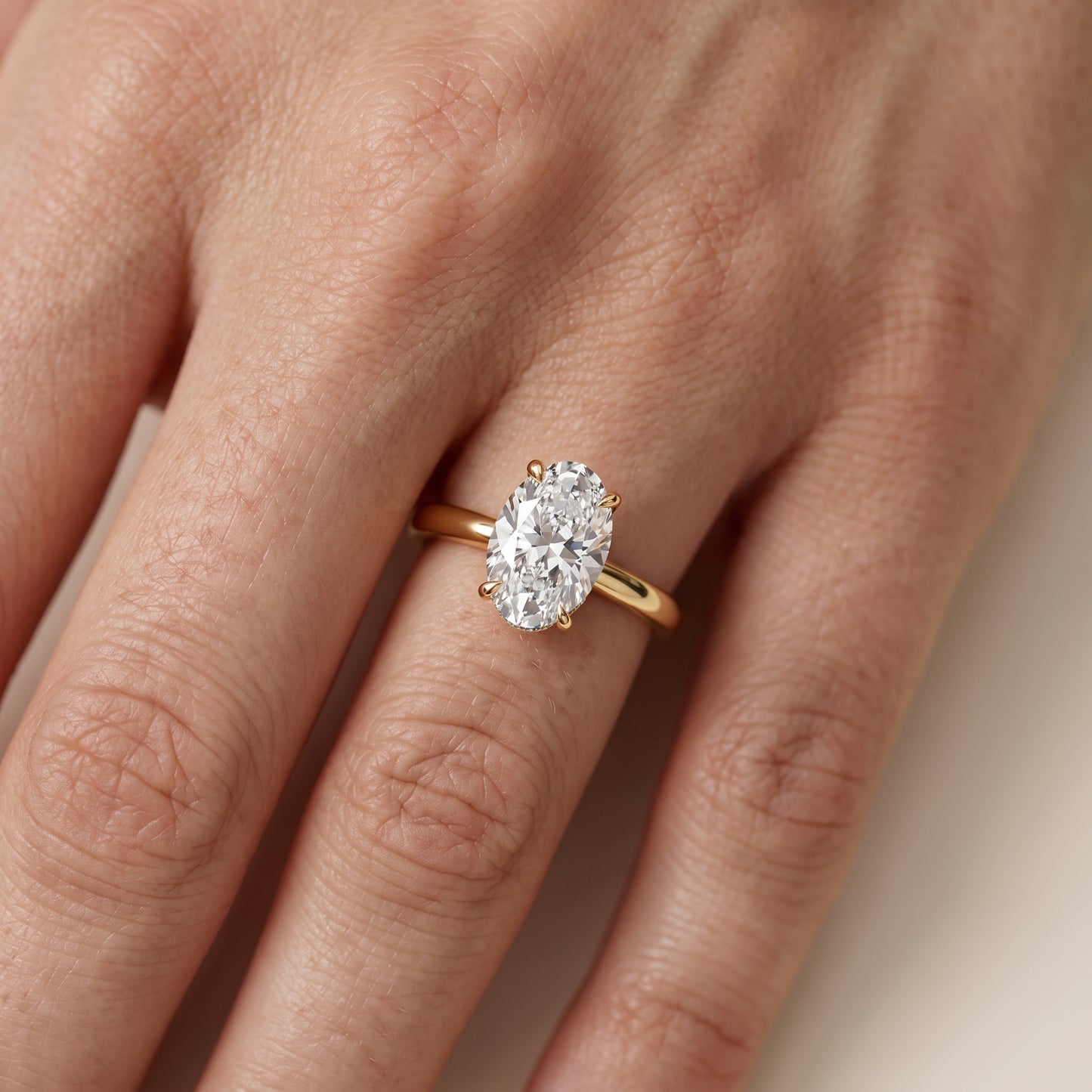 Mena Hidden Halo Oval Diamond Engagement Ring in Yellow Gold - lifestyle.jpg