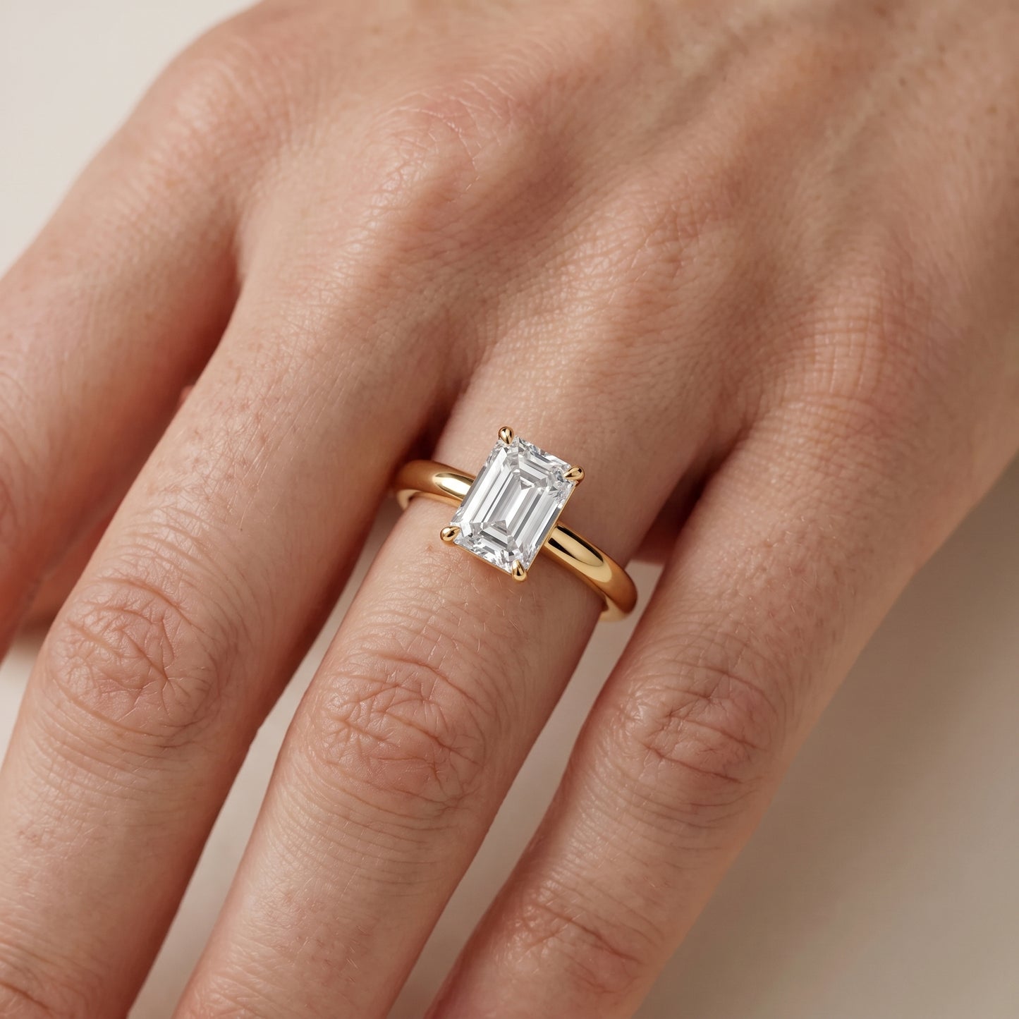 Sadie Cathedral Solitaire Emerald Diamond Ring in Yellow Gold - lifestyle.jpg