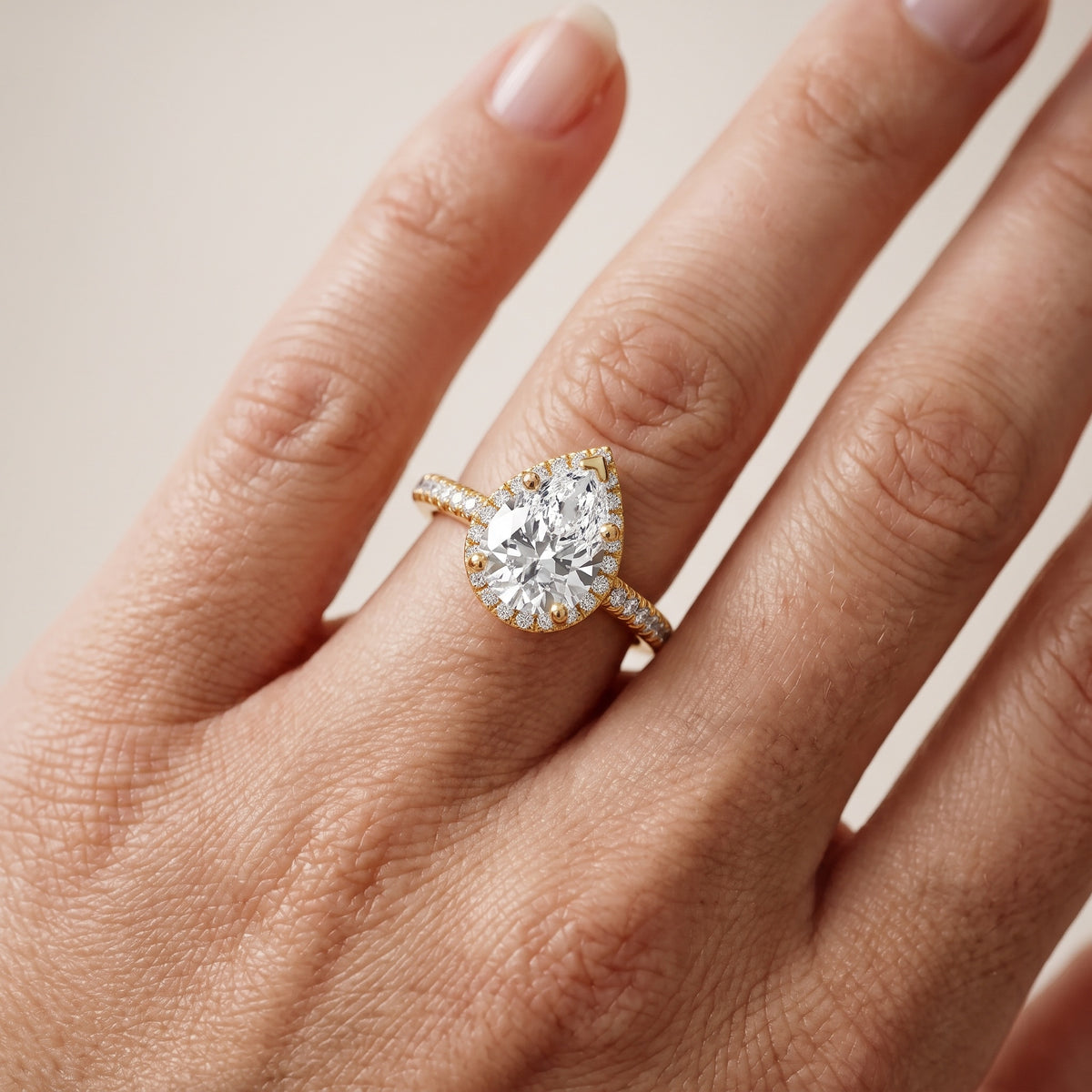 Tempe Halo Pavé Pear Diamond Engagement Ring in Platinum - lifestyle.jpg