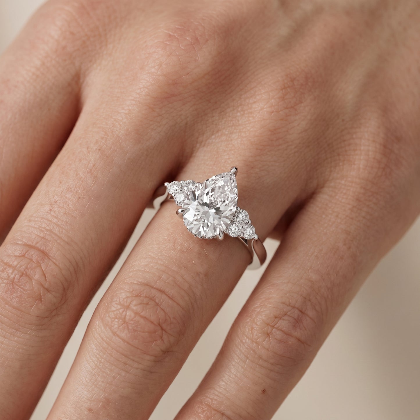 Anya Sidestone Cluster Pear Diamond Ring in Platinum - lifestyle.jpg