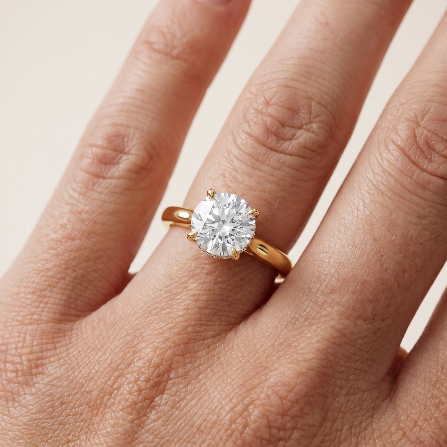 Mena Hidden Halo Round Diamond Engagement Ring in Yellow Gold - lifestyle.jpg
