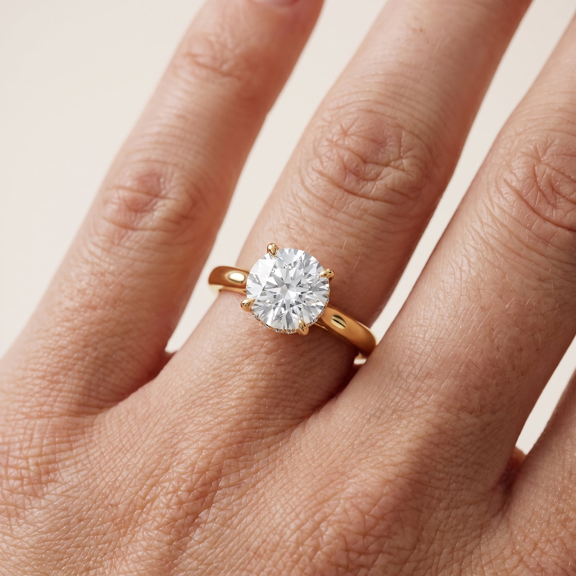 Mena Hidden Halo Round Diamond Engagement Ring in Yellow Gold - lifestyle.jpg