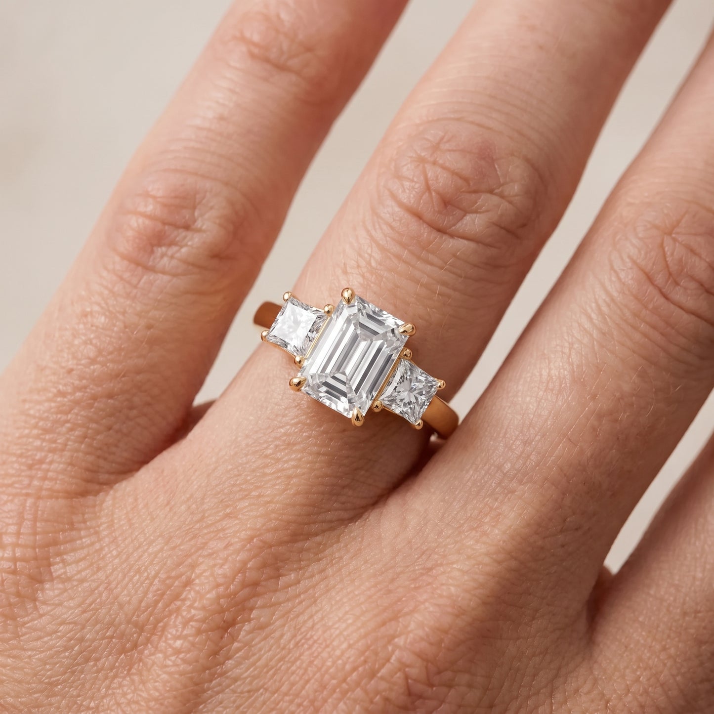 Sienna Three-Stone Emerald Diamond Ring in Yellow Gold - lifestyle.jpg
