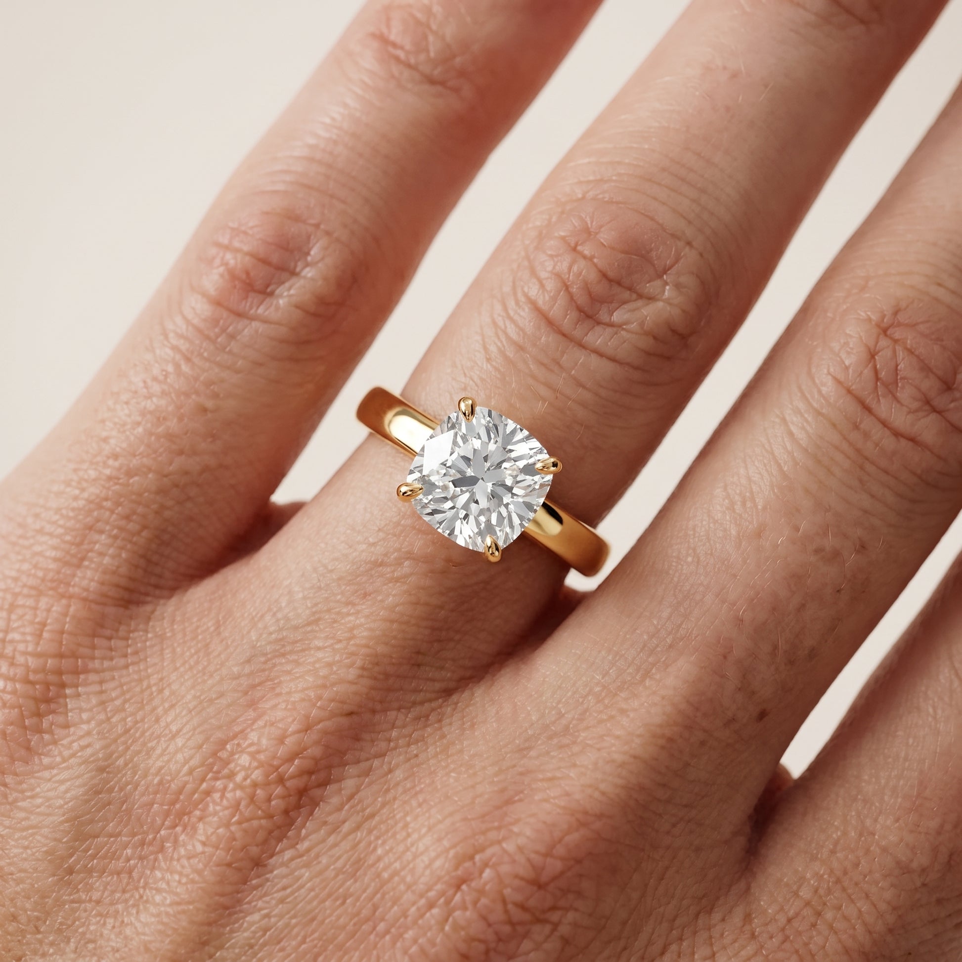 Lara Hidden Halo Cushion Diamond Engagement Ring in Yellow Gold - lifestyle.jpg