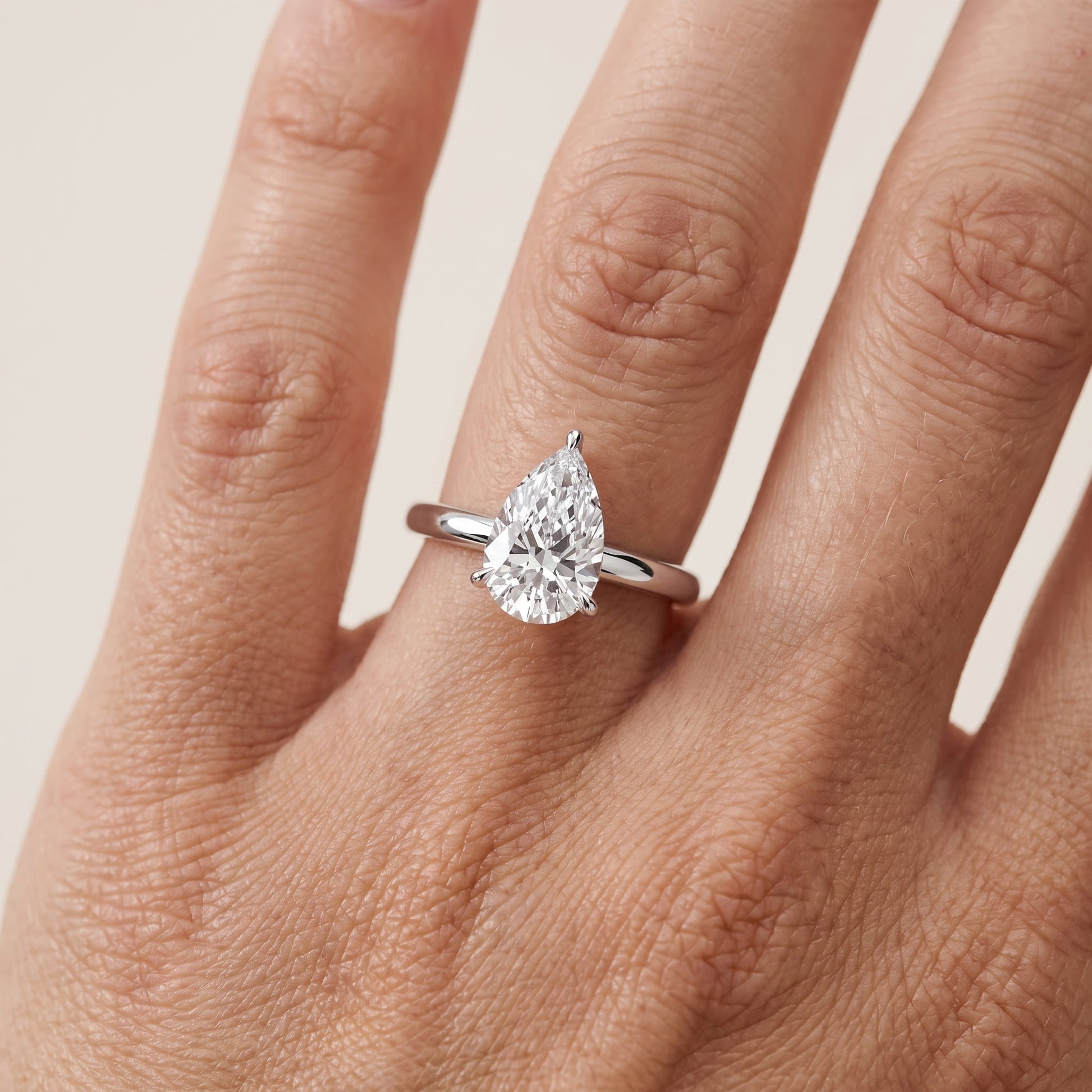 Lyla Petite Solitaire Pear Diamond Engagement Ring in White Gold - lifestyle.jpg