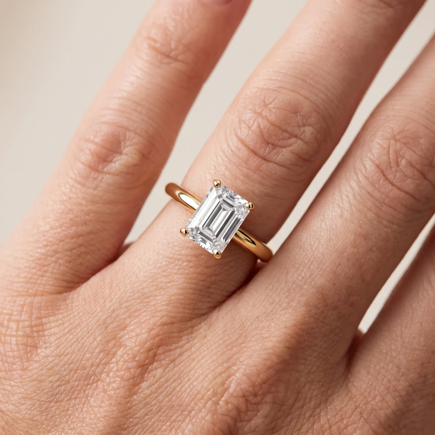 Wren Solitaire Emerald Diamond Ring in Yellow Gold - lifestyle.jpg