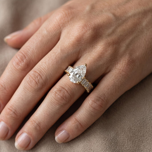 Mallory Shared Prong Pear Diamond Engagement Ring in Yellow Gold - lifestyle.jpg