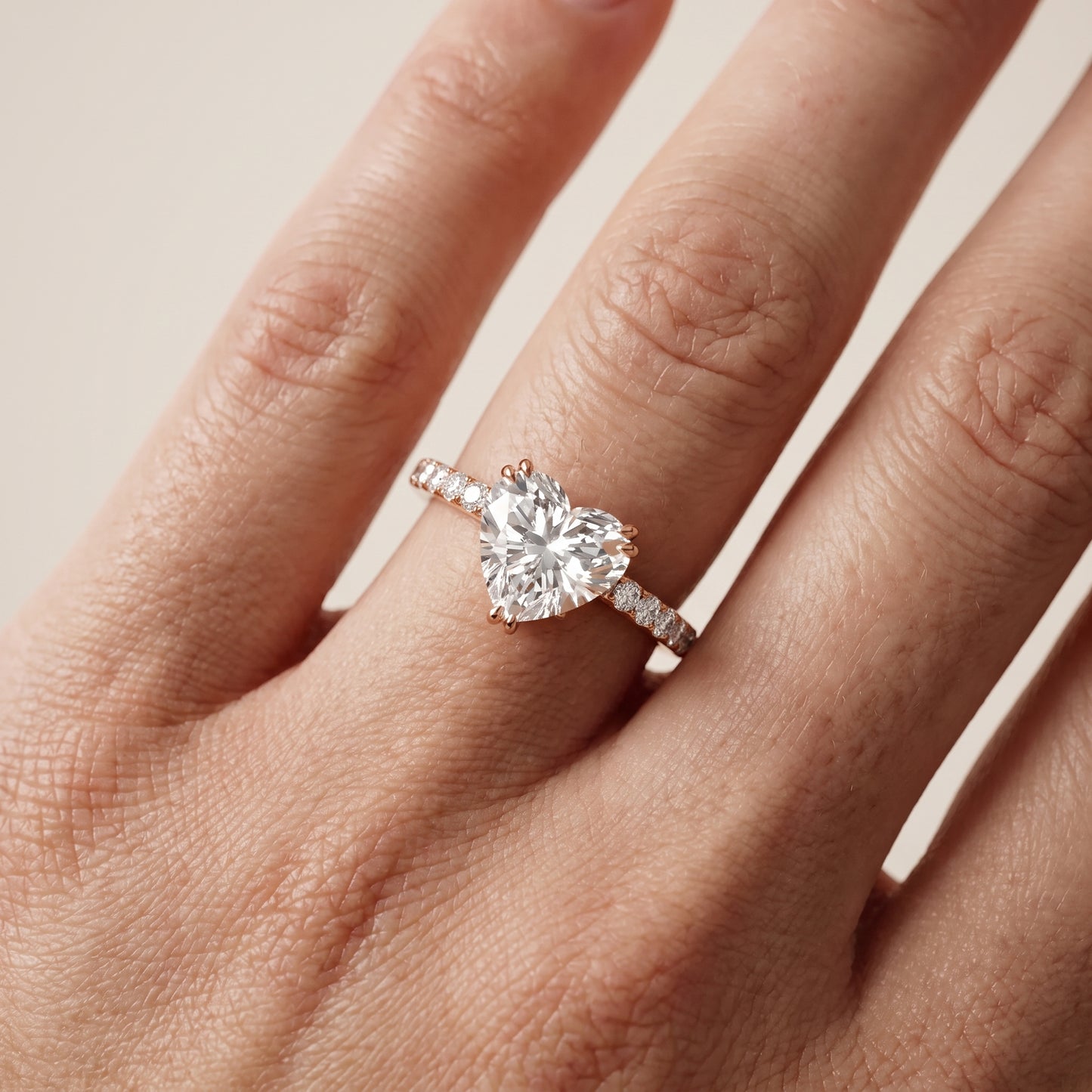 Novara Solitaire Pavé Heart Diamond Ring in Rose Gold - lifestyle.jpg