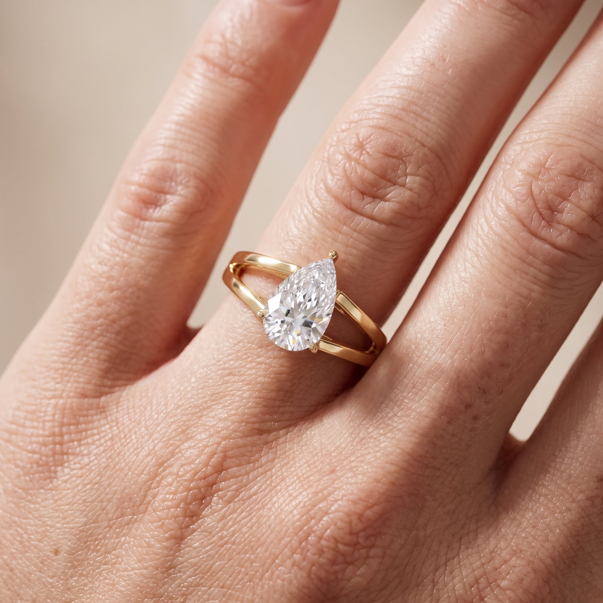 Giselle Solitaire Split Shank Pear Diamond Engagement Ring in Yellow Gold - lifestyle.jpg