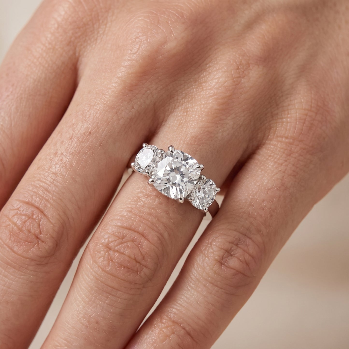 Esme Three-Stone Tapered Cushion Diamond Ring in Platinum - lifestyle.jpg