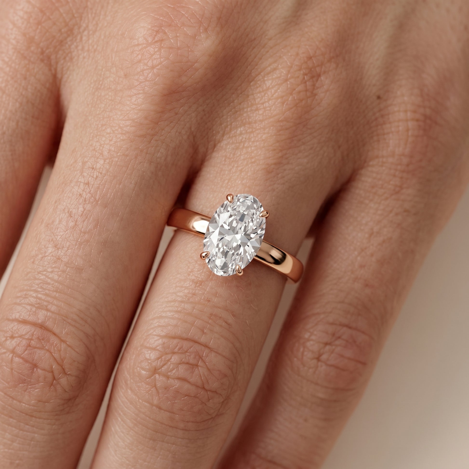 Lara Hidden Halo Oval Diamond Engagement Ring in Rose Gold - lifestyle.jpg