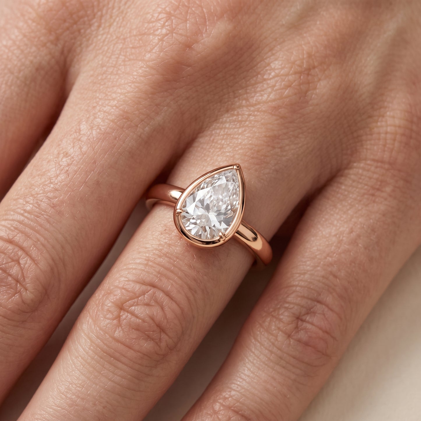 Alina Bezel Solitaire Pear Diamond Ring in Rose Gold - lifestyle.jpg