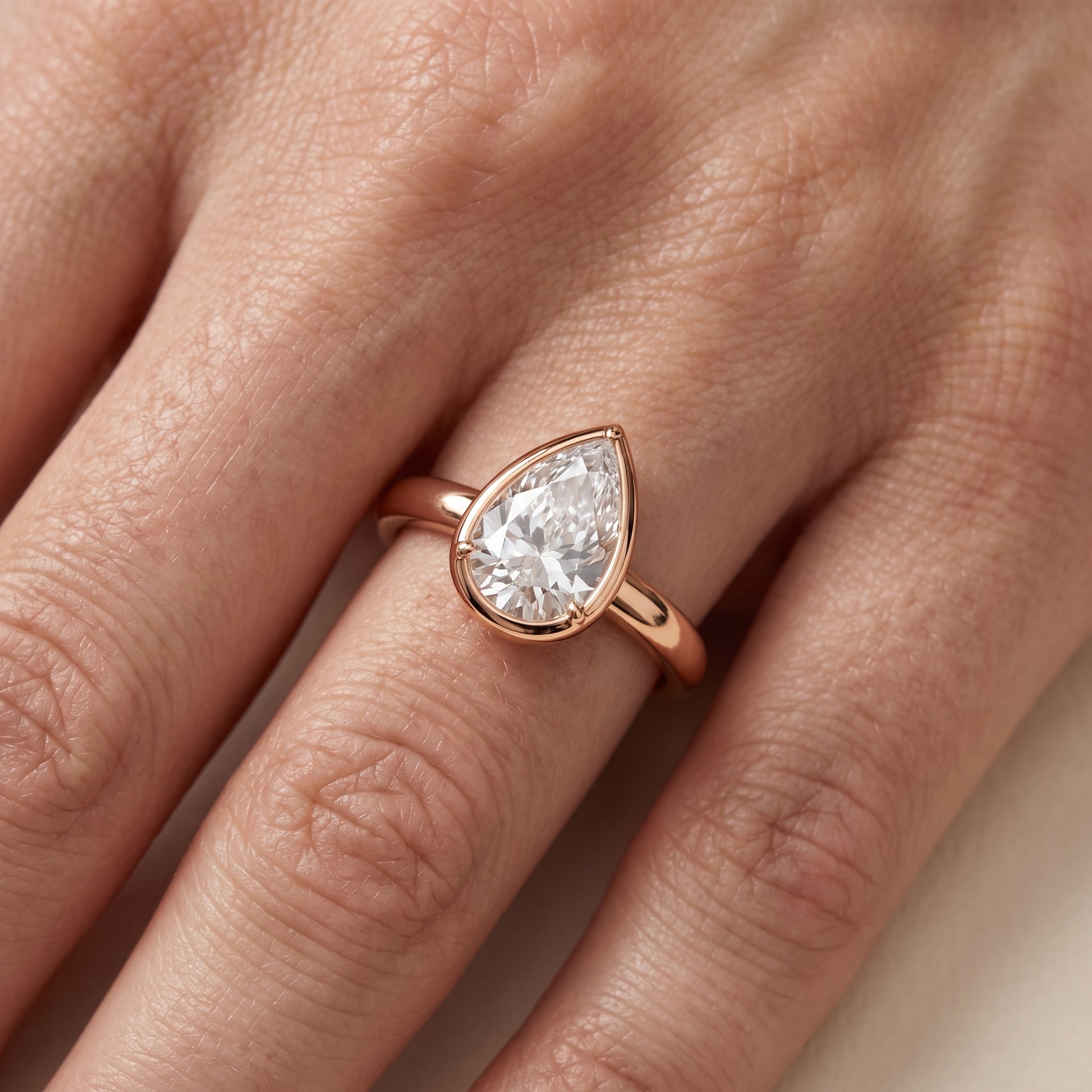 Alina Bezel Solitaire Pear Diamond Ring in Rose Gold - lifestyle.jpg