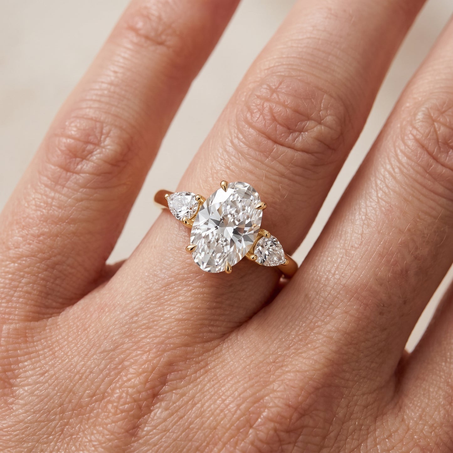 Phoebe Three-Stone Oval Diamond Ring in Yellow Gold - lifestyle.jpg