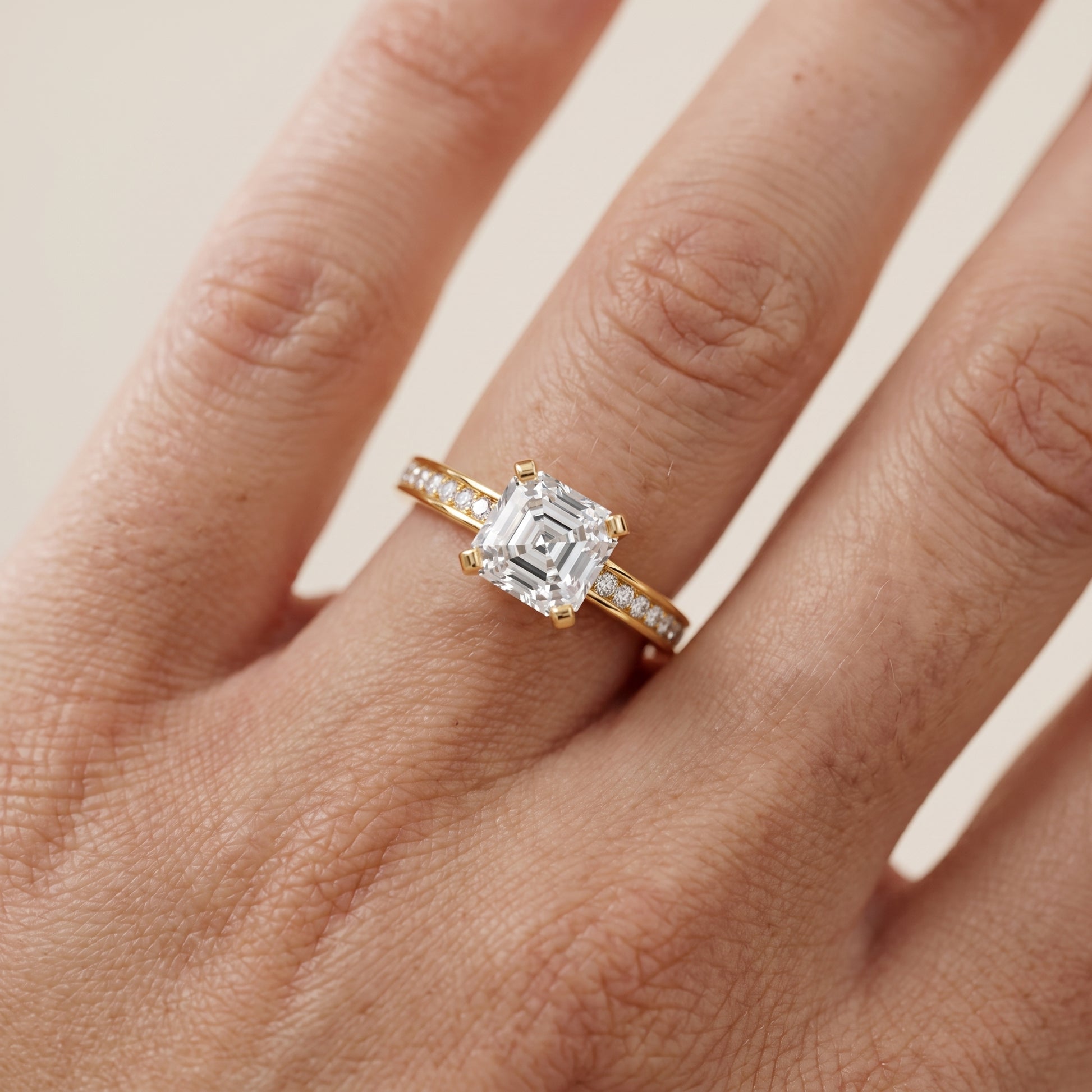 Tessa Solitaire Channel Set Asscher Diamond Engagement Ring in Yellow Gold - lifestyle.jpg