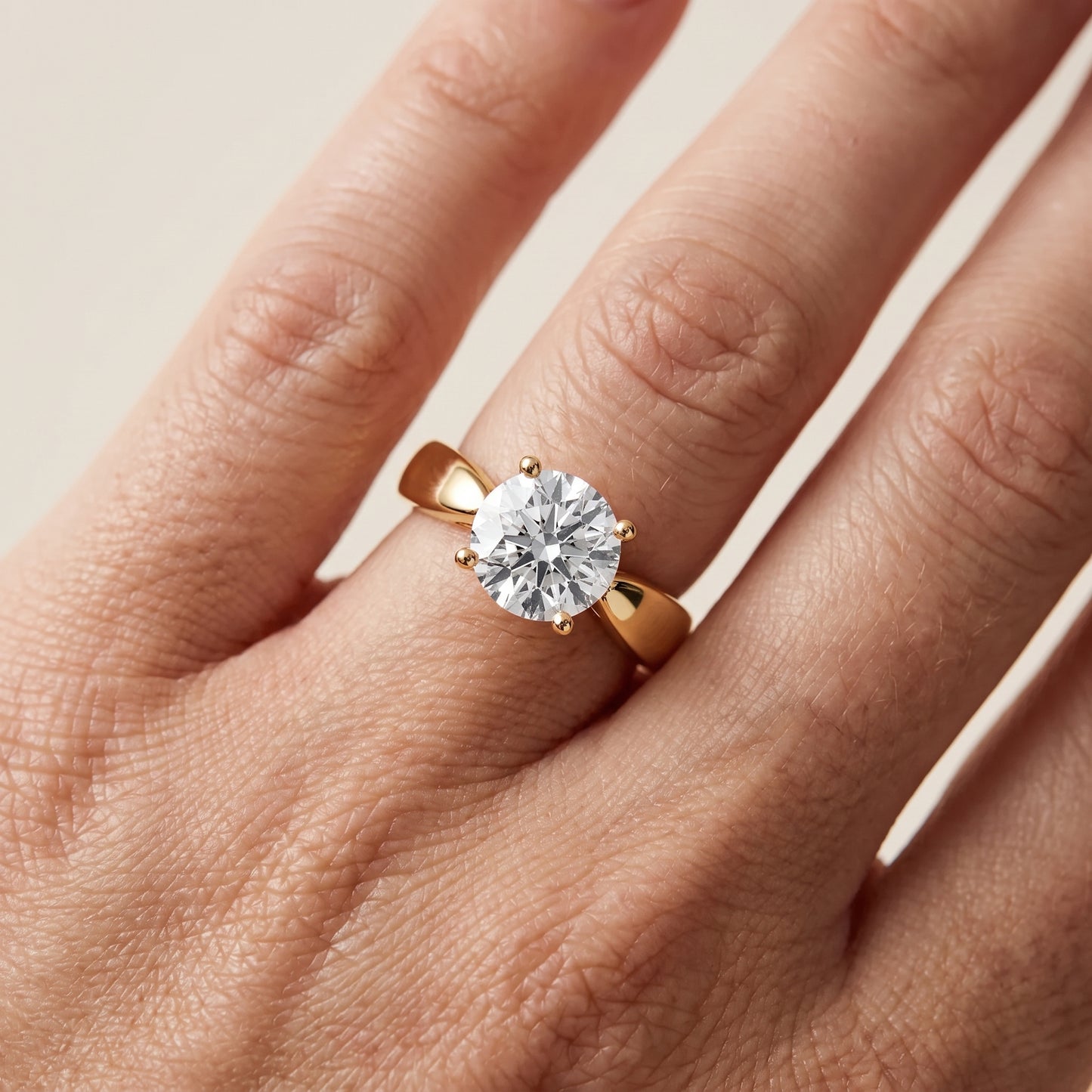 Talia Solitaire Twist Round Diamond Engagement Ring in Yellow Gold - lifestyle.jpg