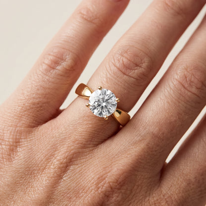 Talia Solitaire Twist Round Diamond Engagement Ring in Yellow Gold - lifestyle.jpg