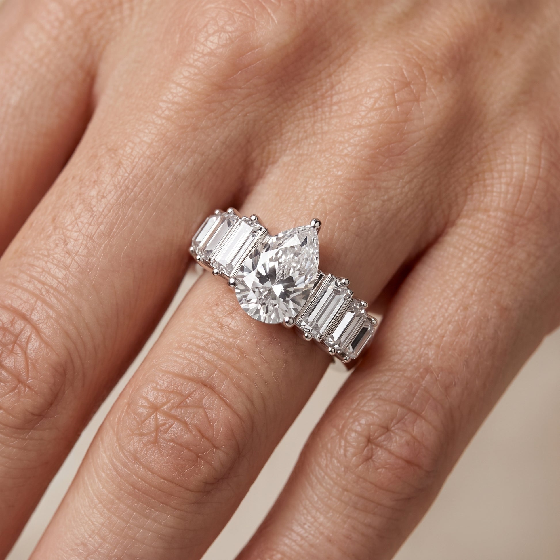 Mara Sidestone Baguette Accent Pear Diamond Engagement Ring in Silver - lifestyle.jpg