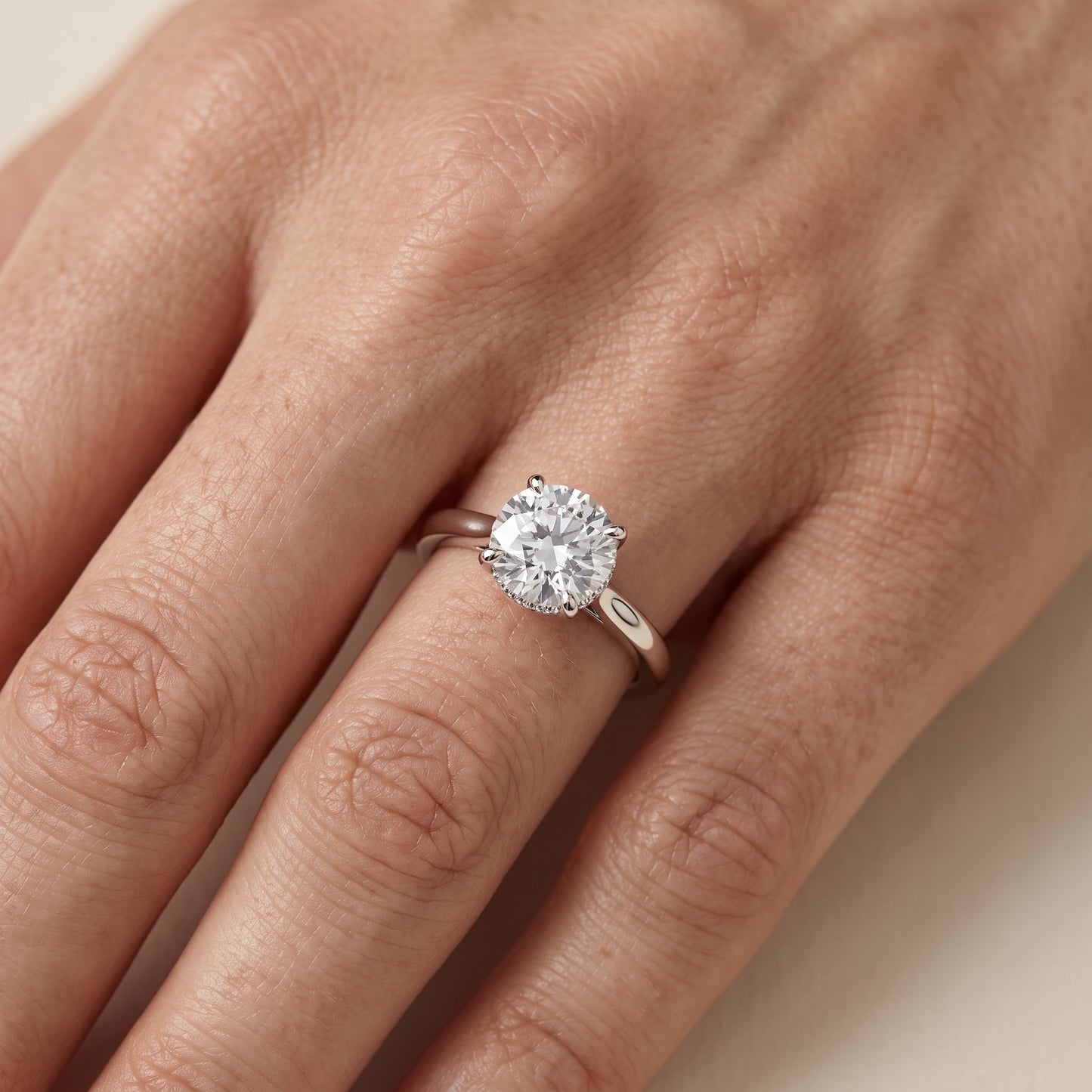 Mena Hidden Halo Round Diamond Engagement Ring in White Gold - lifestyle.jpg