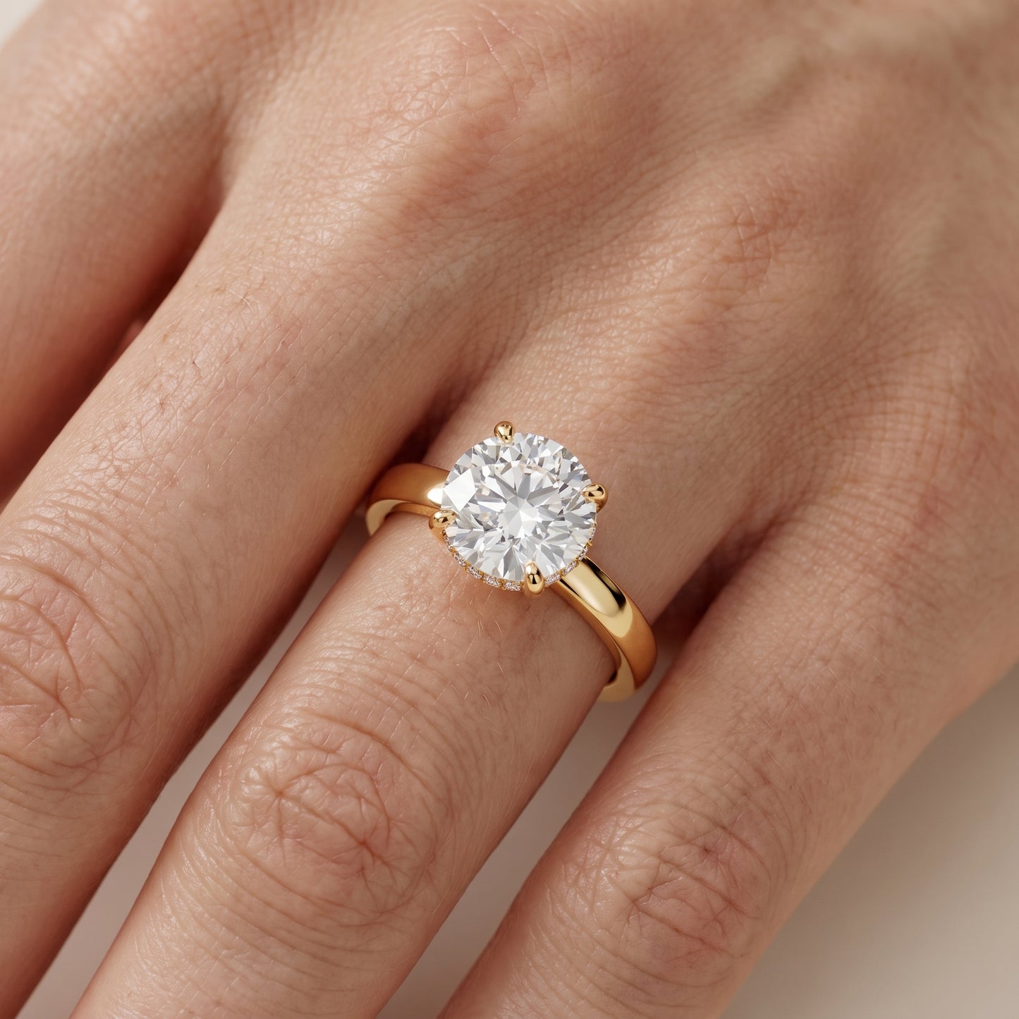 Lara Hidden Halo Round Diamond Engagement Ring in Yellow Gold - lifestyle.jpg