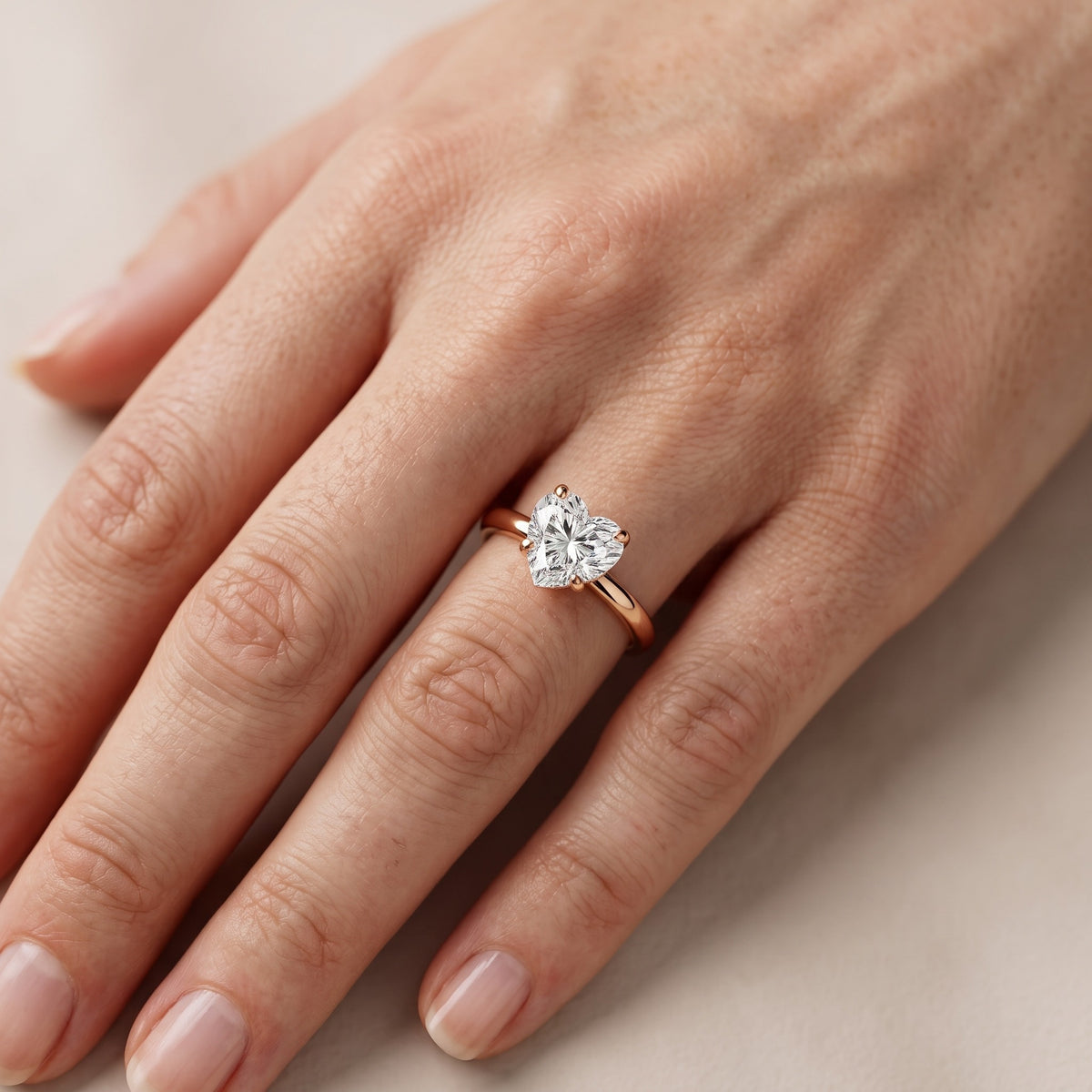 Charlotte Charm Solitaire Heart Diamond Engagement Ring in Rose Gold - lifestyle.jpg