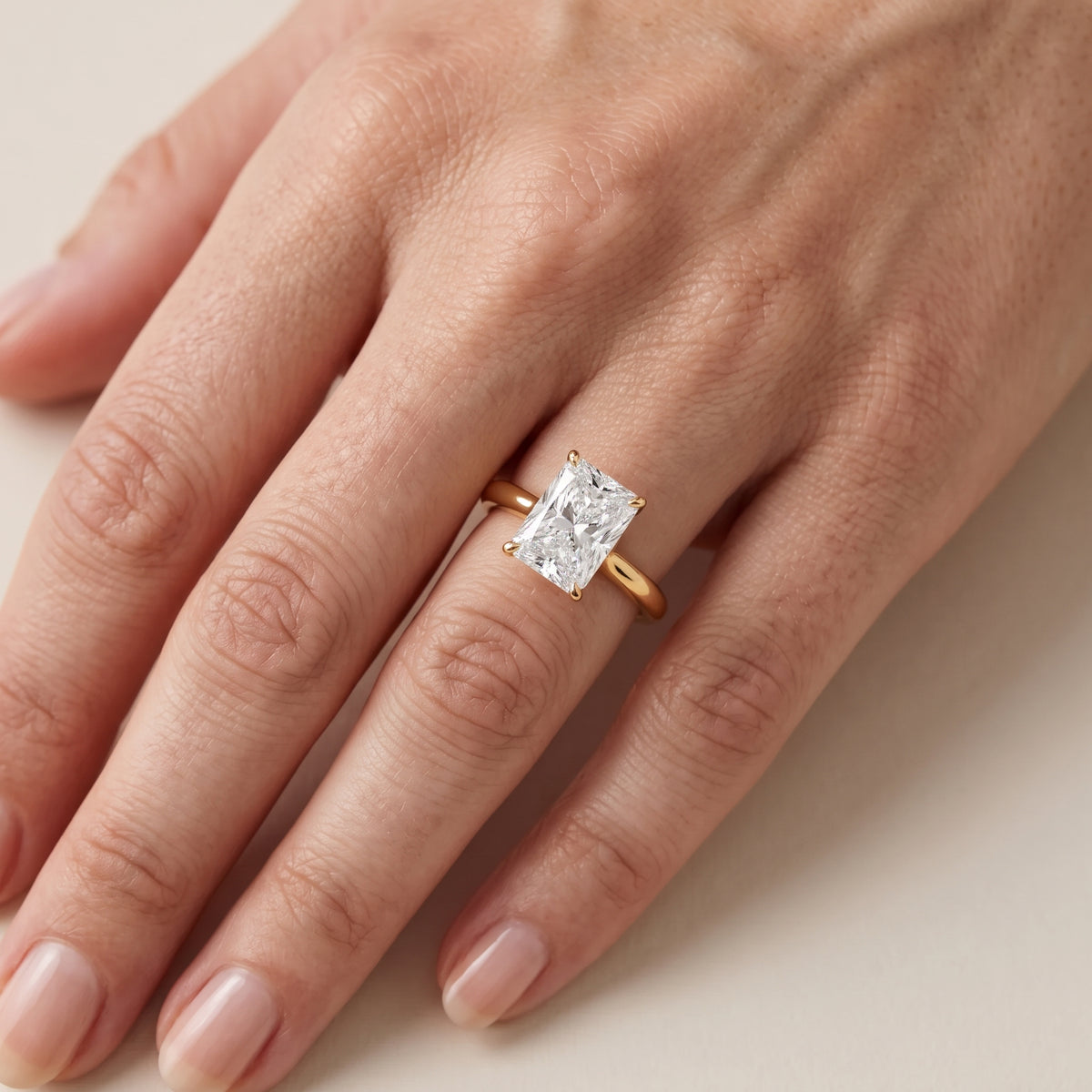 Evie Solitaire Six-Prong Radiant Diamond Engagement Ring in Yellow Gold - lifestyle.jpg