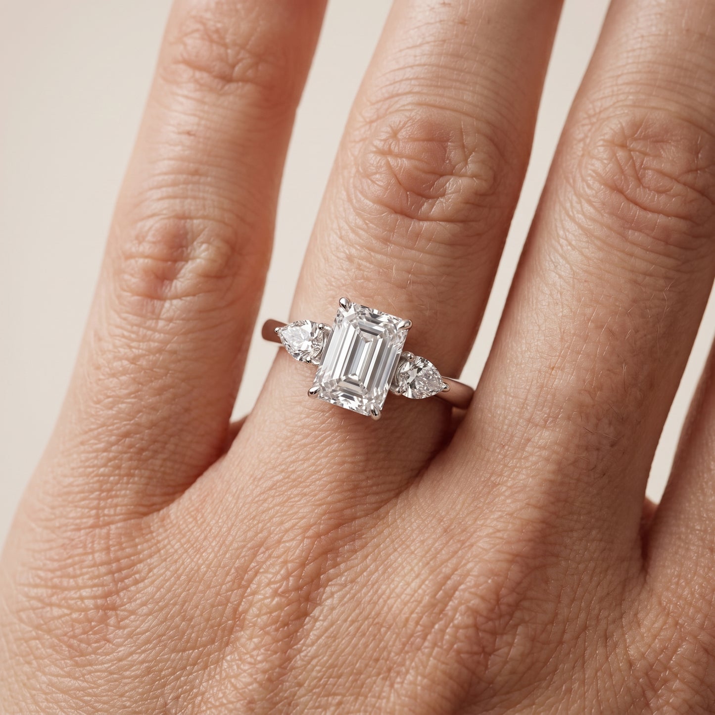 Phoebe Three-Stone Emerald Diamond Ring in Platinum - lifestyle.jpg