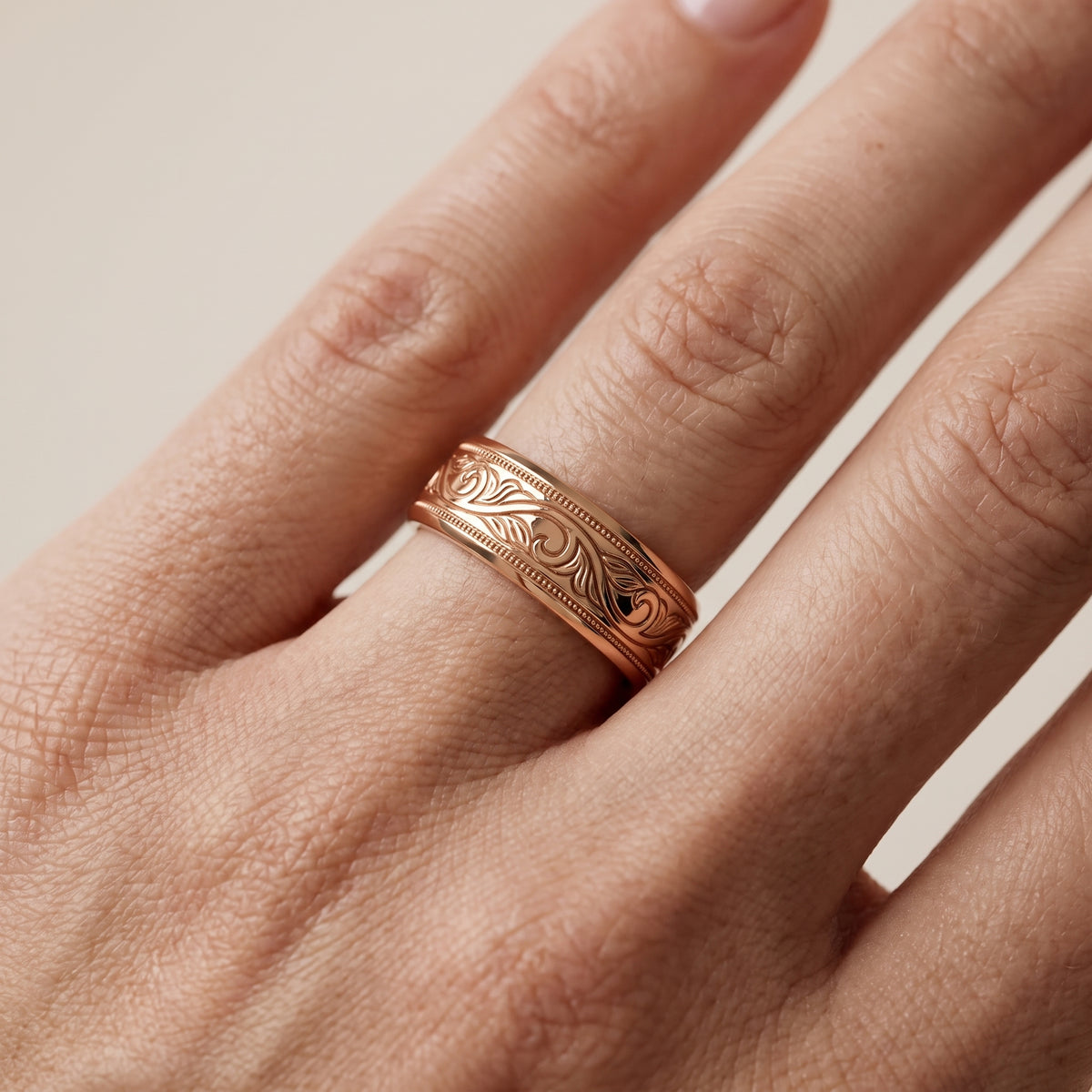 Navya Carved Milgrain Wedding Band in Rose Gold - lifestyle.jpg