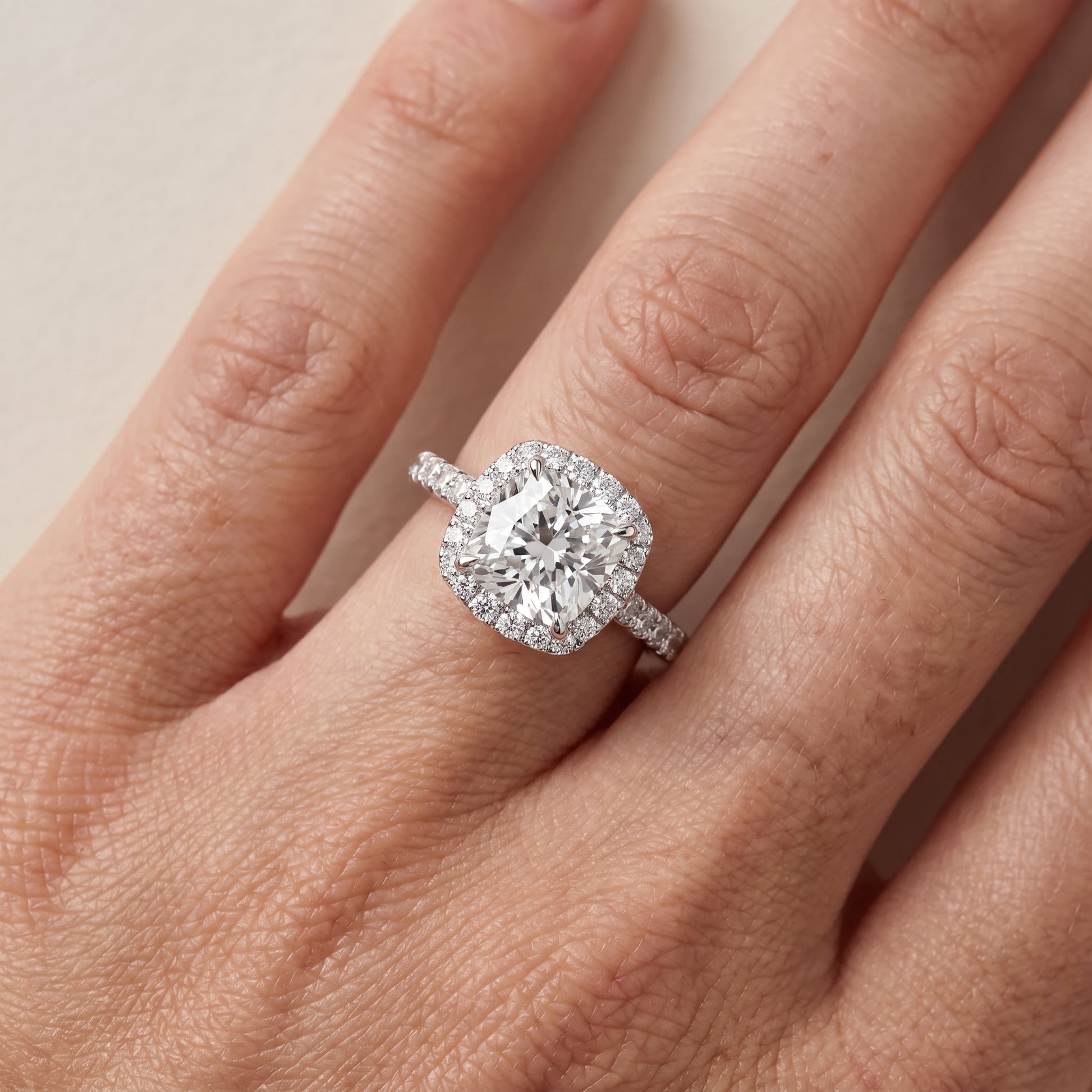Alma Halo Pavé Cushion Diamond Ring in Platinum - lifestyle.jpg