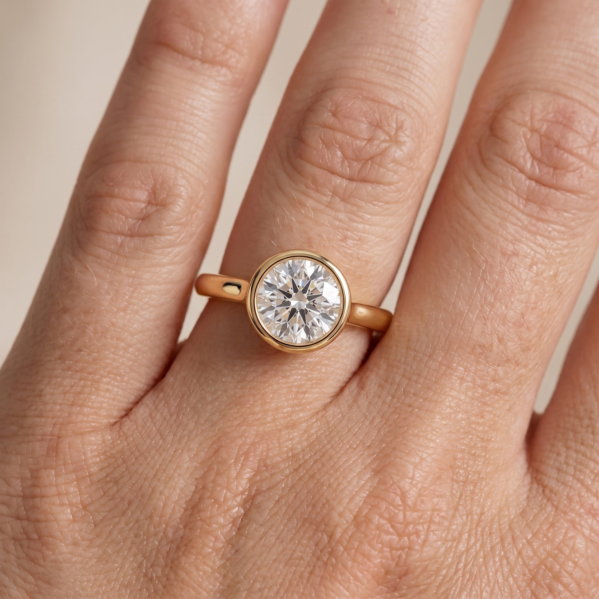Jolie Bezel Solitaire Round Diamond Engagement Ring in Yellow Gold - lifestyle.jpg