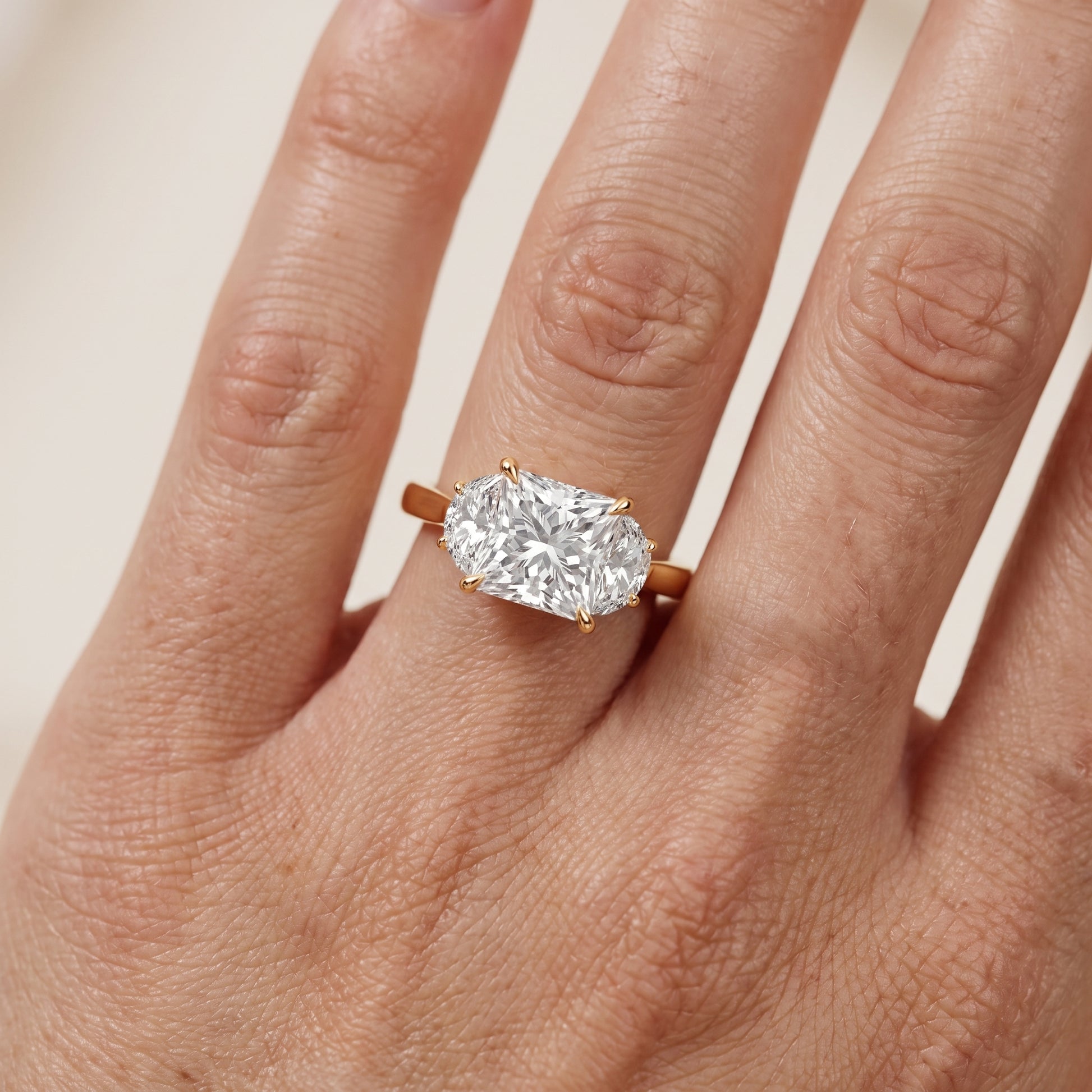 Romy Three-Stone Princess Diamond Engagement Ring in Yellow Gold - lifestyle.jpg