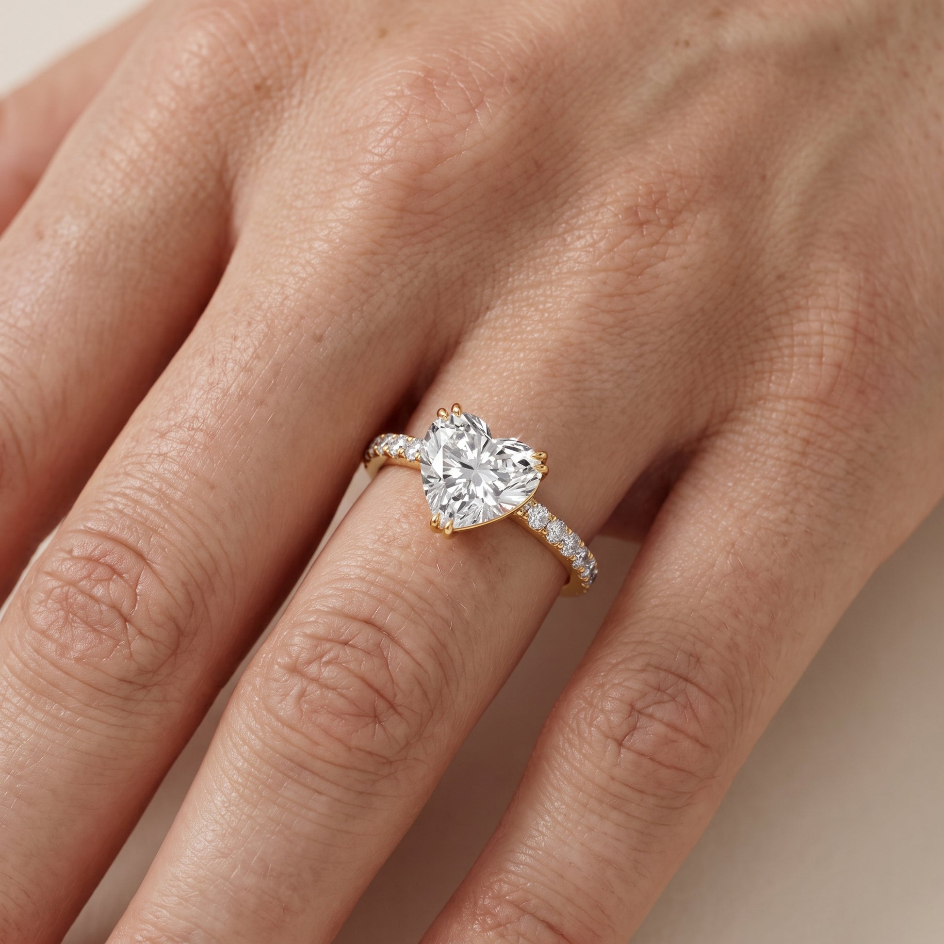Novara Solitaire Pavé Heart Diamond Ring in Yellow Gold - lifestyle.jpg