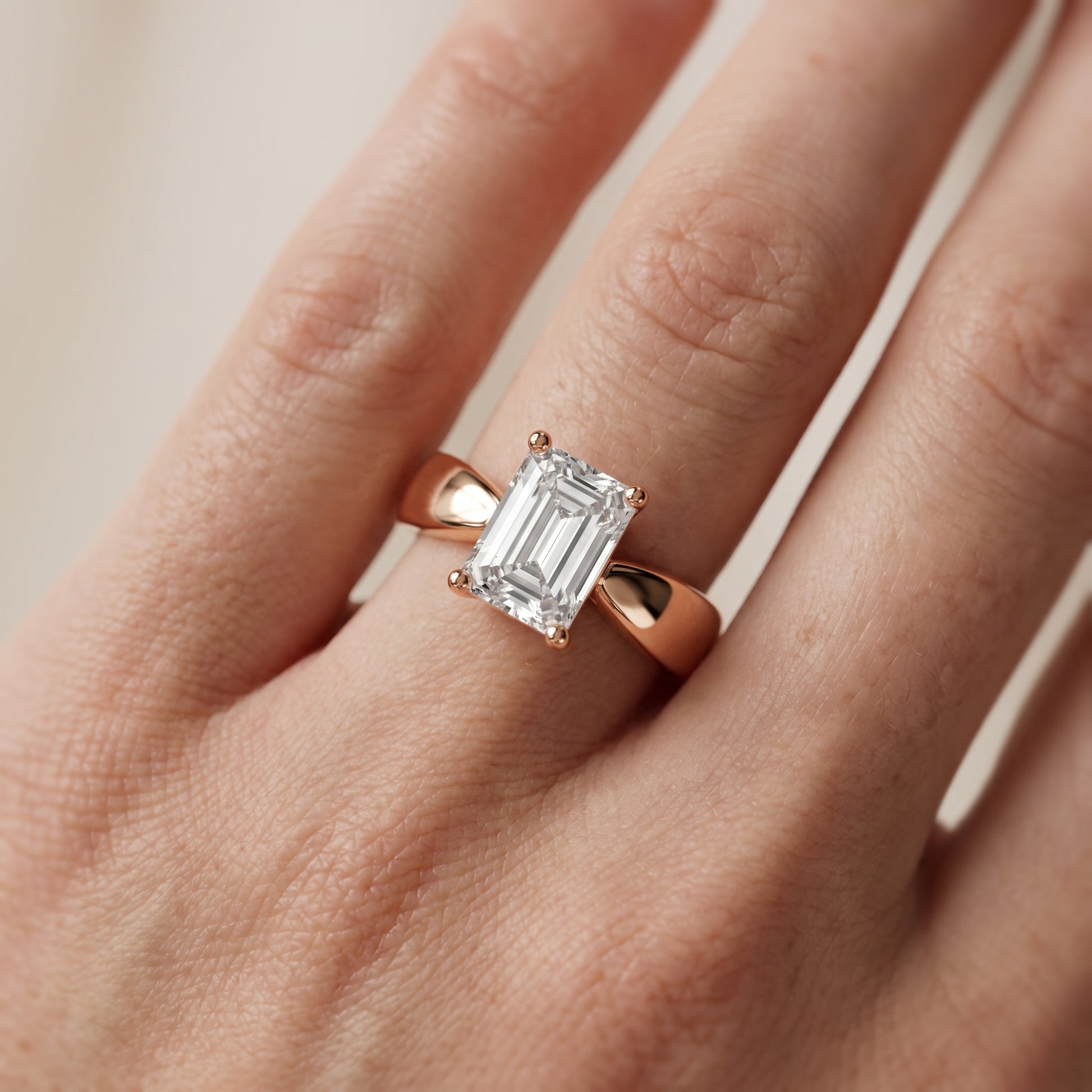 Talia Solitaire Twist Emerald Diamond Engagement Ring in Rose Gold - lifestyle.jpg