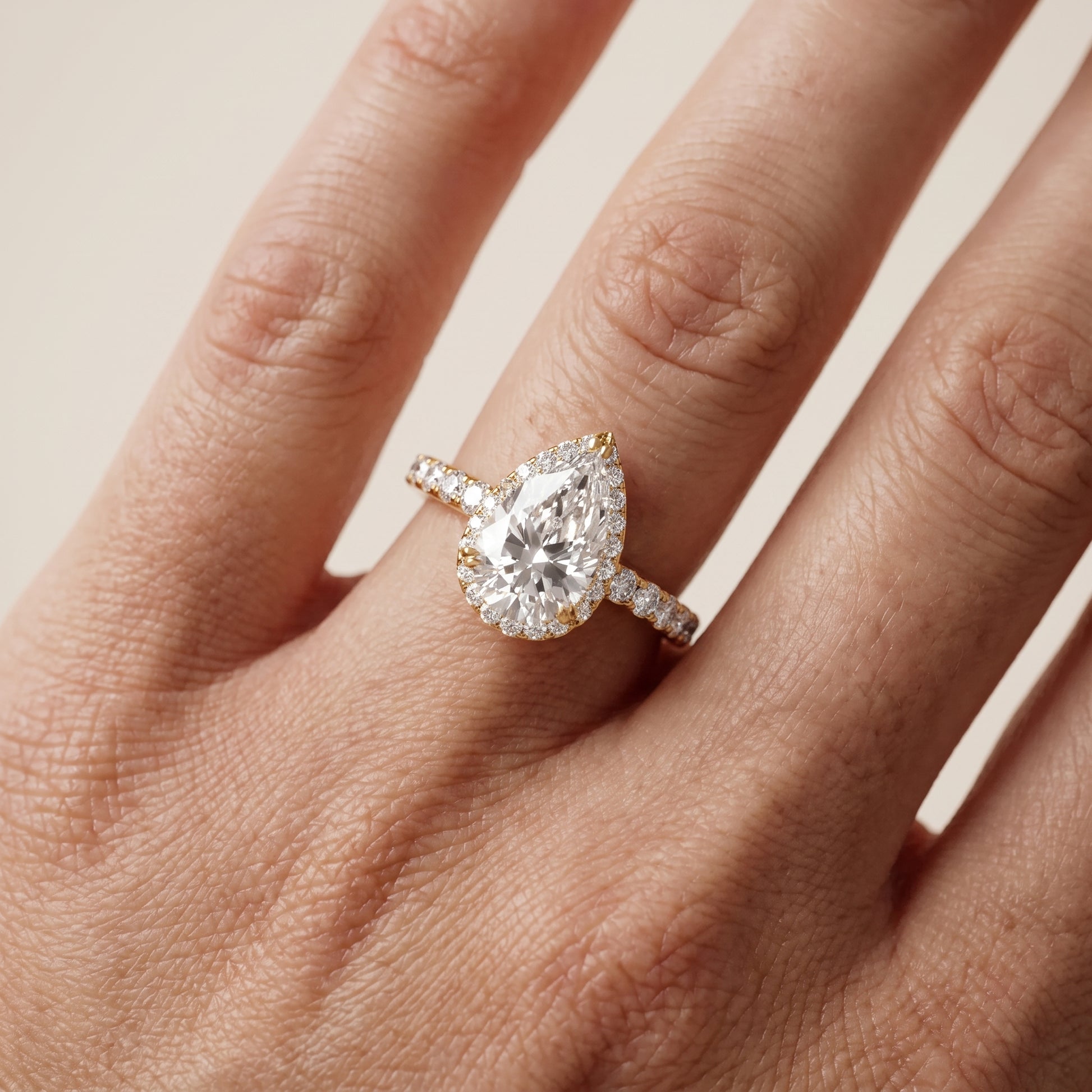 Chloe Halo Pavé Pear Diamond Ring in Yellow Gold - lifestyle.jpg