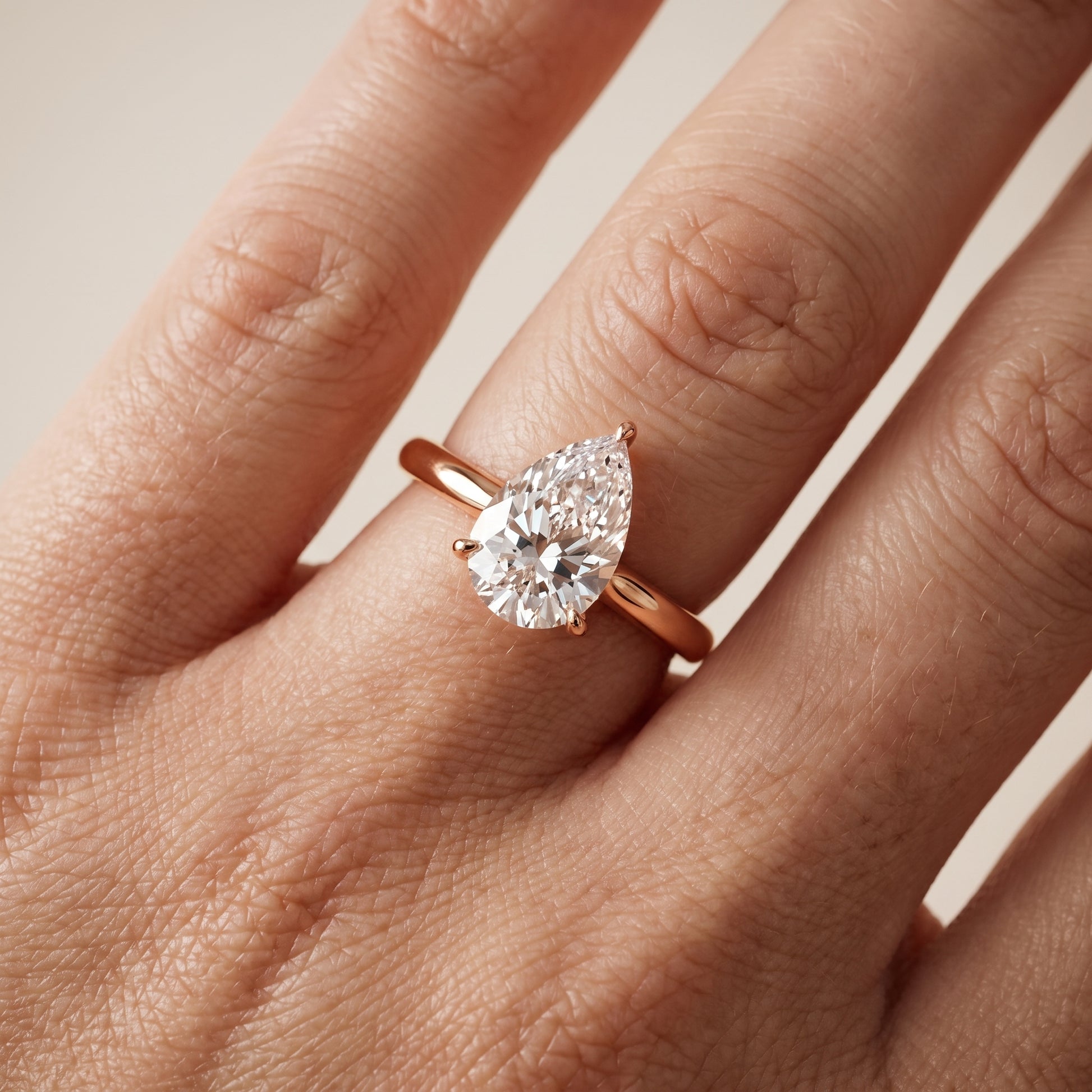 Kalia Knife Edge Solitaire Pear Diamond Engagement Ring in Rose Gold - lifestyle.jpg