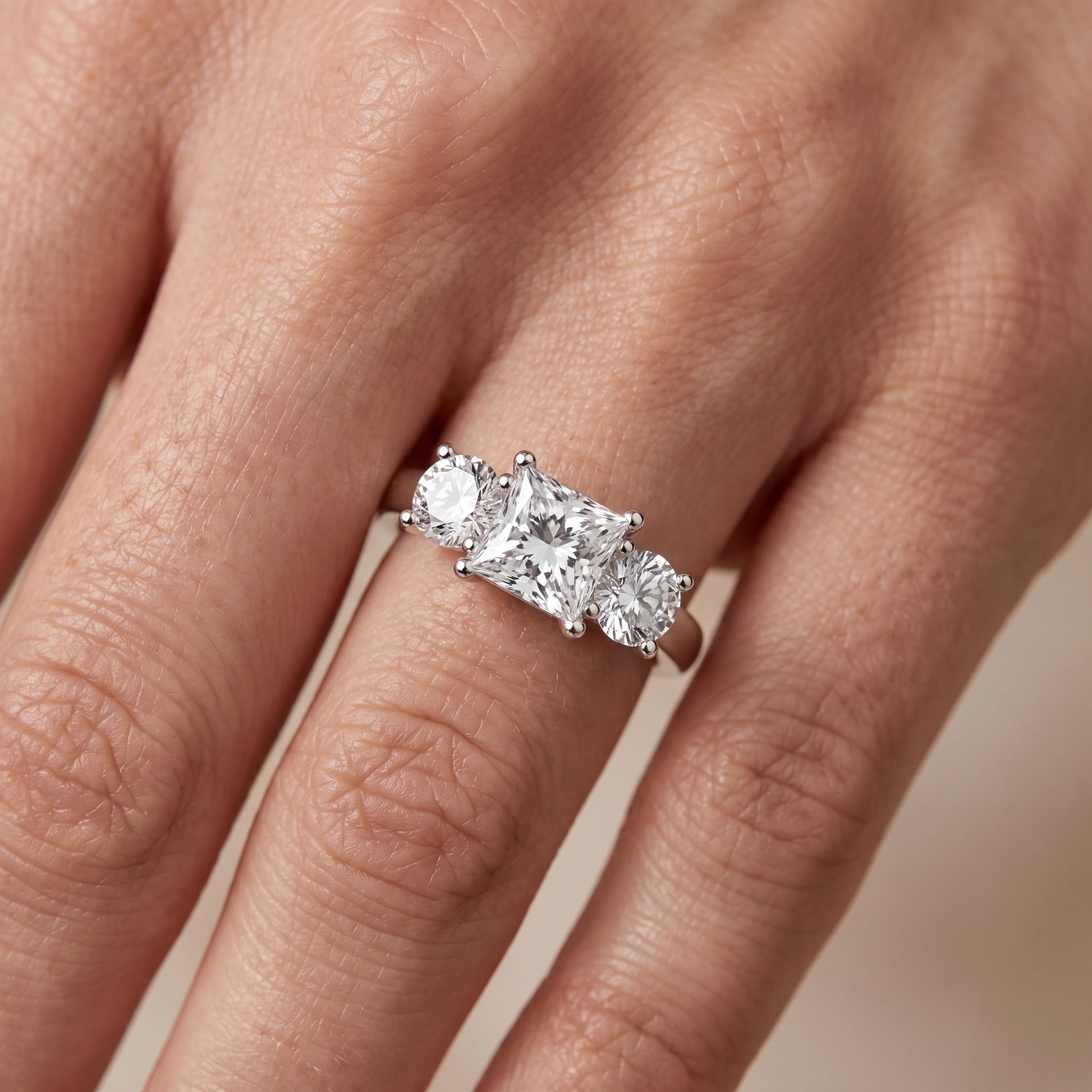 Callie Three-Stone Trellis Princess Diamond Engagement Ring in Platinum - lifestyle.jpg