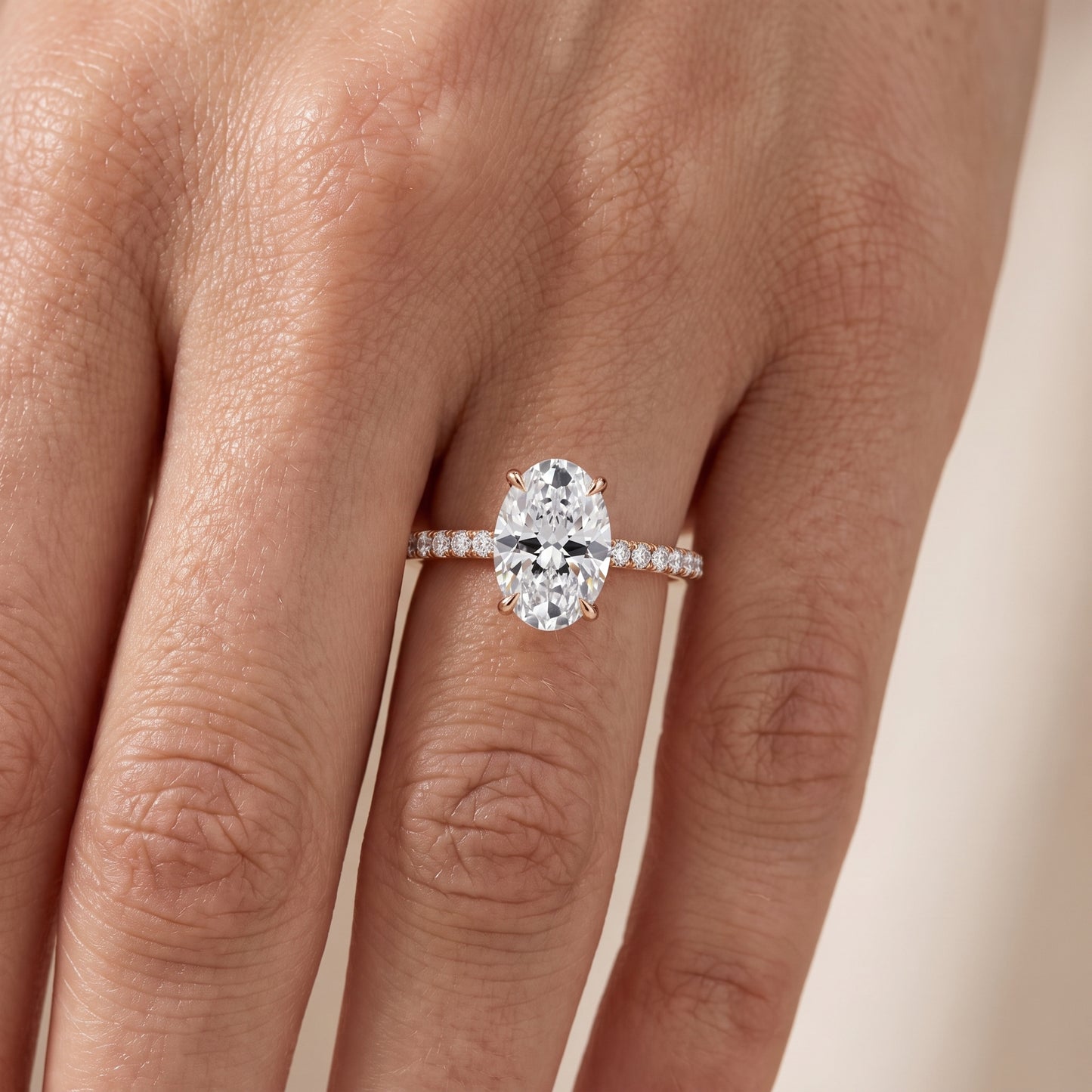 Ione Solitaire Pavé Oval Diamond Engagement Ring in Rose Gold - lifestyle.jpg
