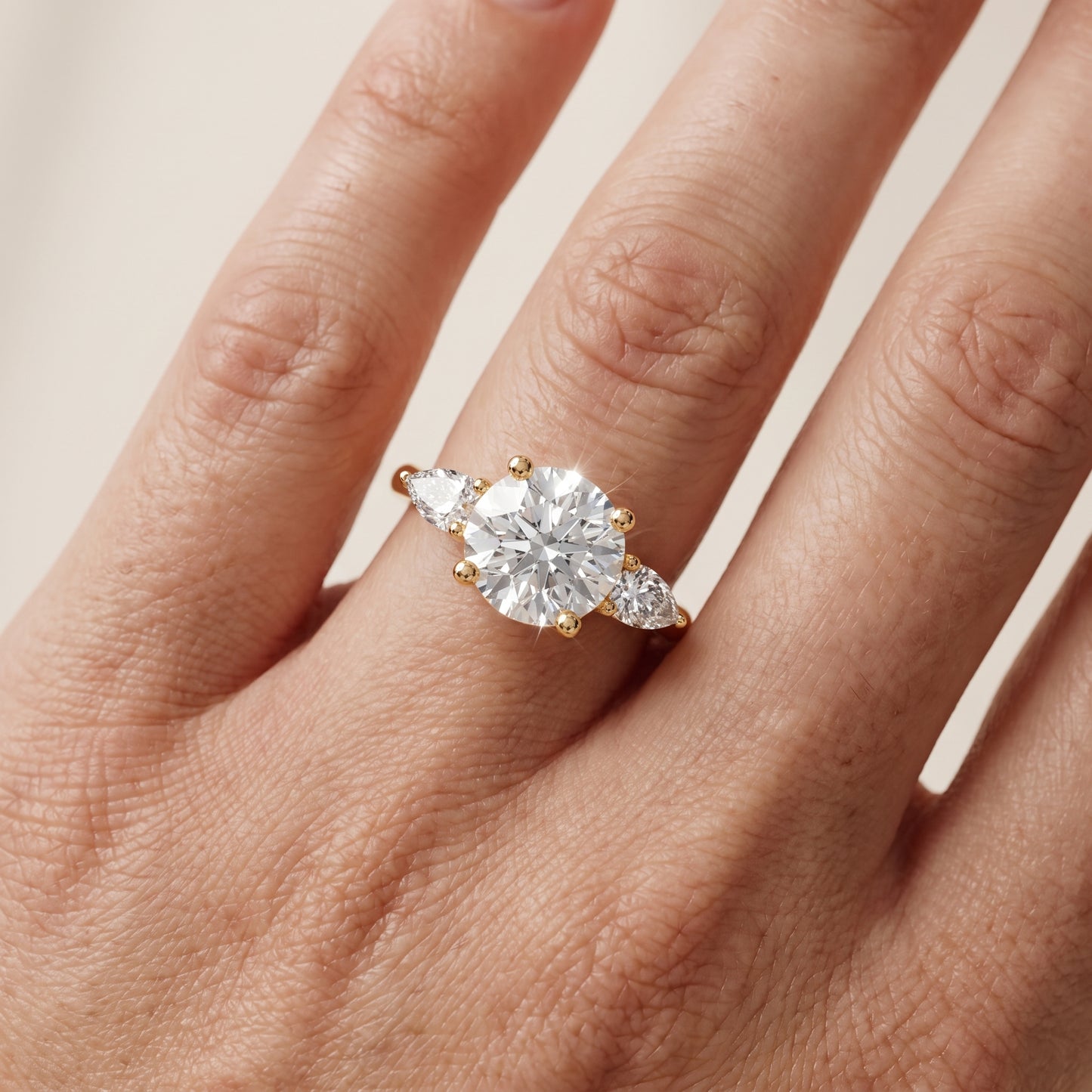 Faye Three-Stone Trellis Round Diamond Ring in Yellow Gold - lifestyle.jpg