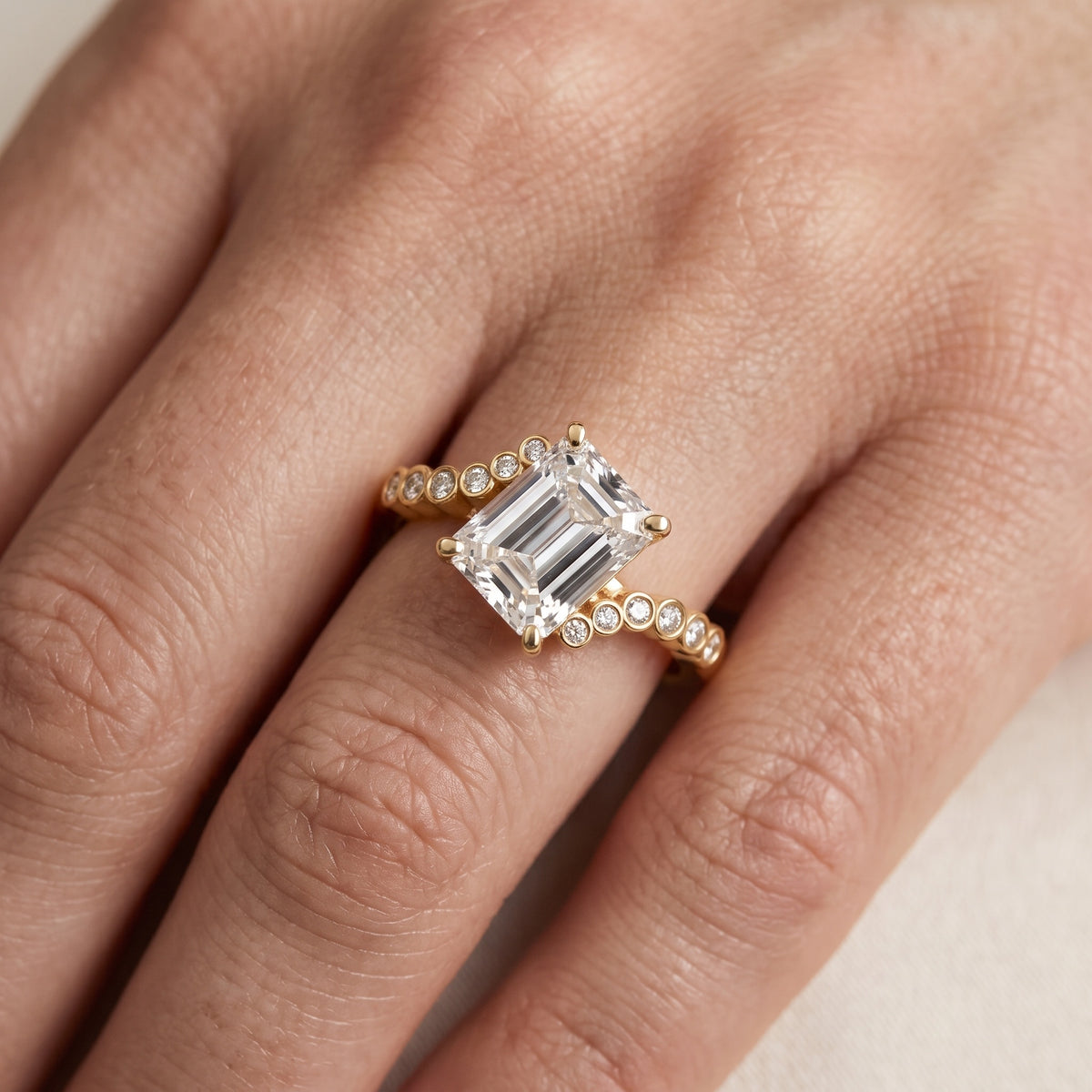 Chatham Bezel Bypass Emerald Diamond Engagement Ring in Yellow Gold - lifestyle.jpg