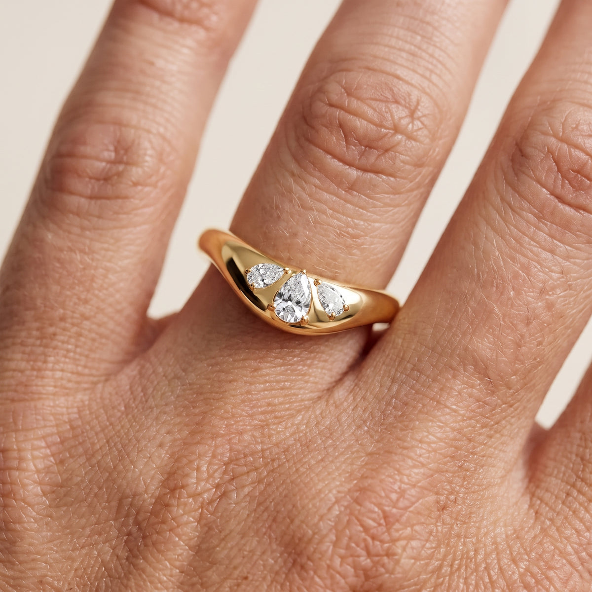 Beatrice Curved Contour Pear Diamond Wedding Band in Yellow Gold - lifestyle.jpg