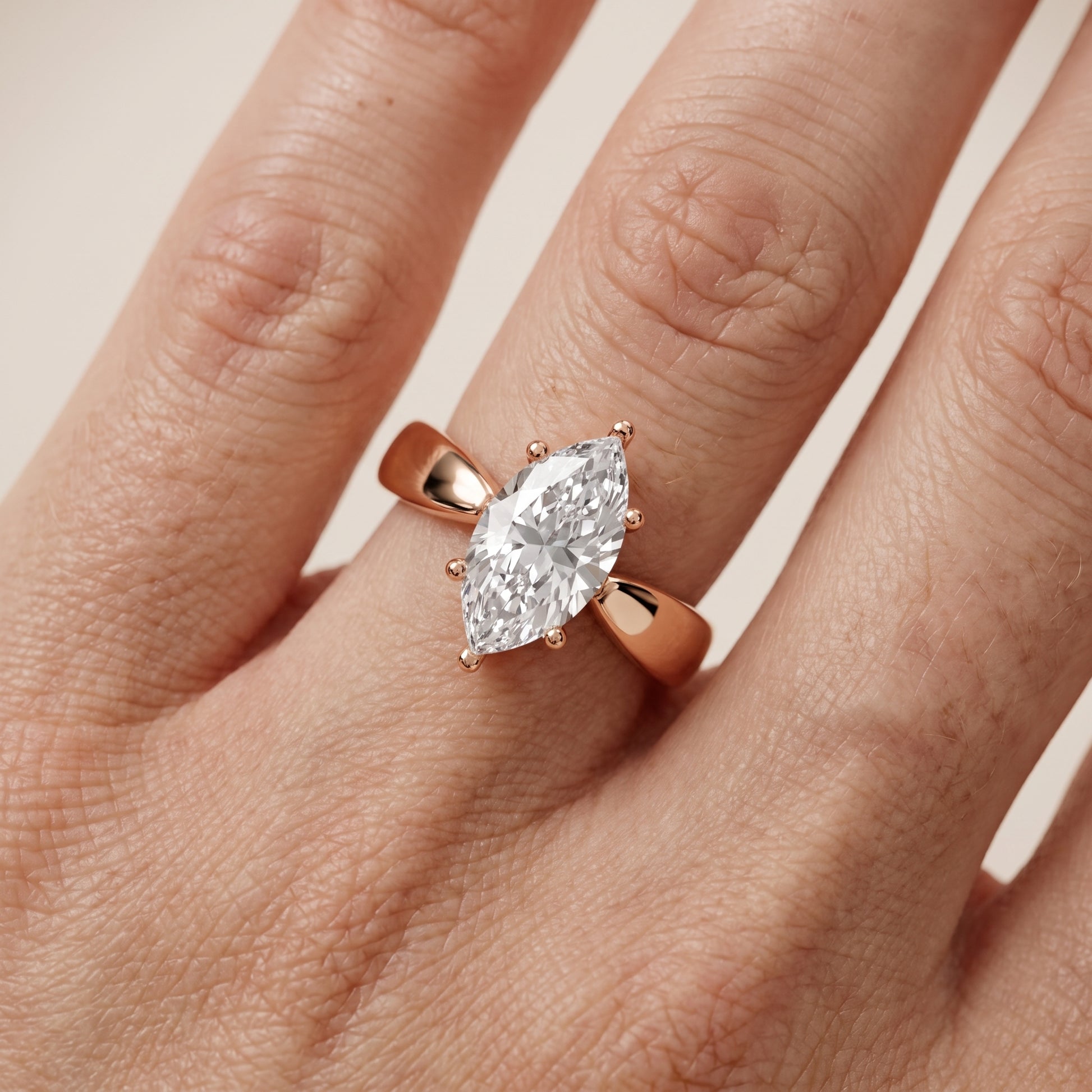 Talia Solitaire Twist Marquise Diamond Engagement Ring in Rose Gold - lifestyle.jpg
