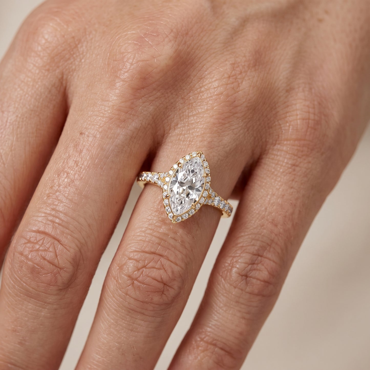 Bella Halo Pavé Marquise Diamond Engagement Ring in Yellow Gold - lifestyle.jpg