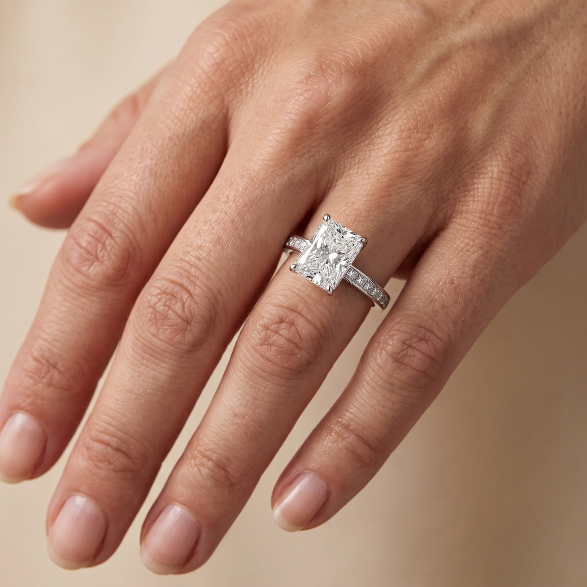 Brielle Channel Set Solitaire Radiant Diamond Engagement Ring in Platinum - lifestyle.jpg
