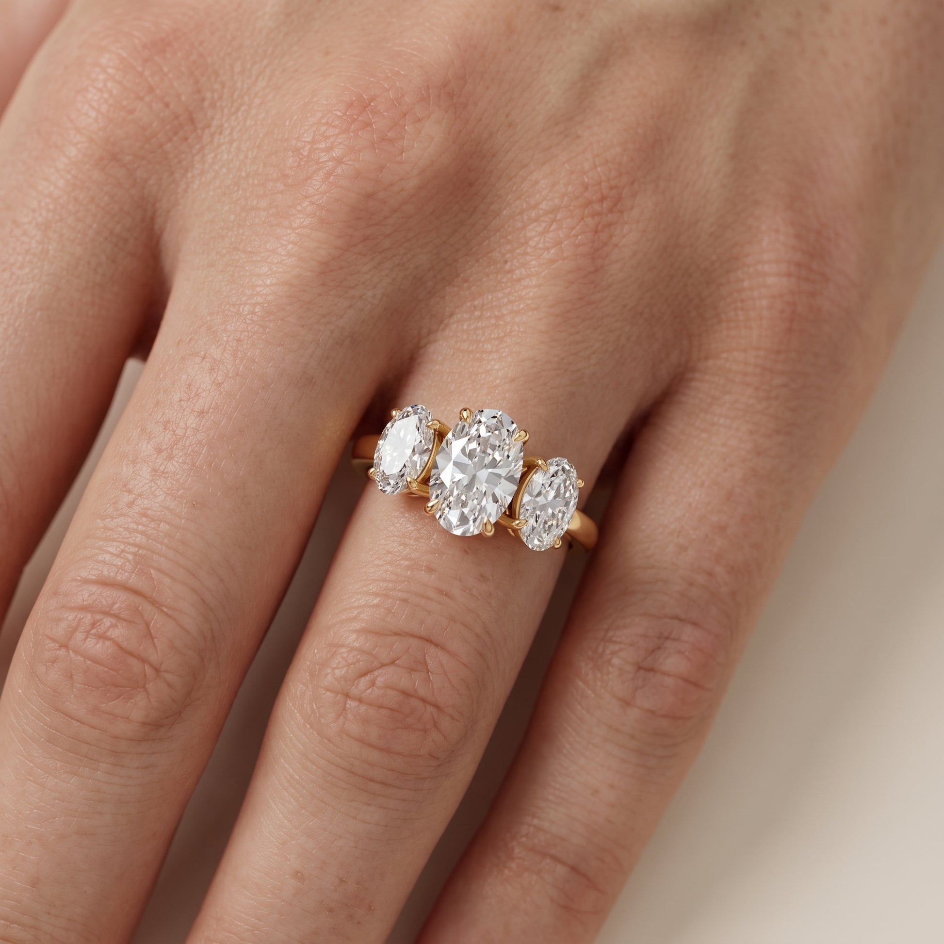 Lila Three-Stone Oval Diamond Ring in Yellow Gold - lifestyle.jpg