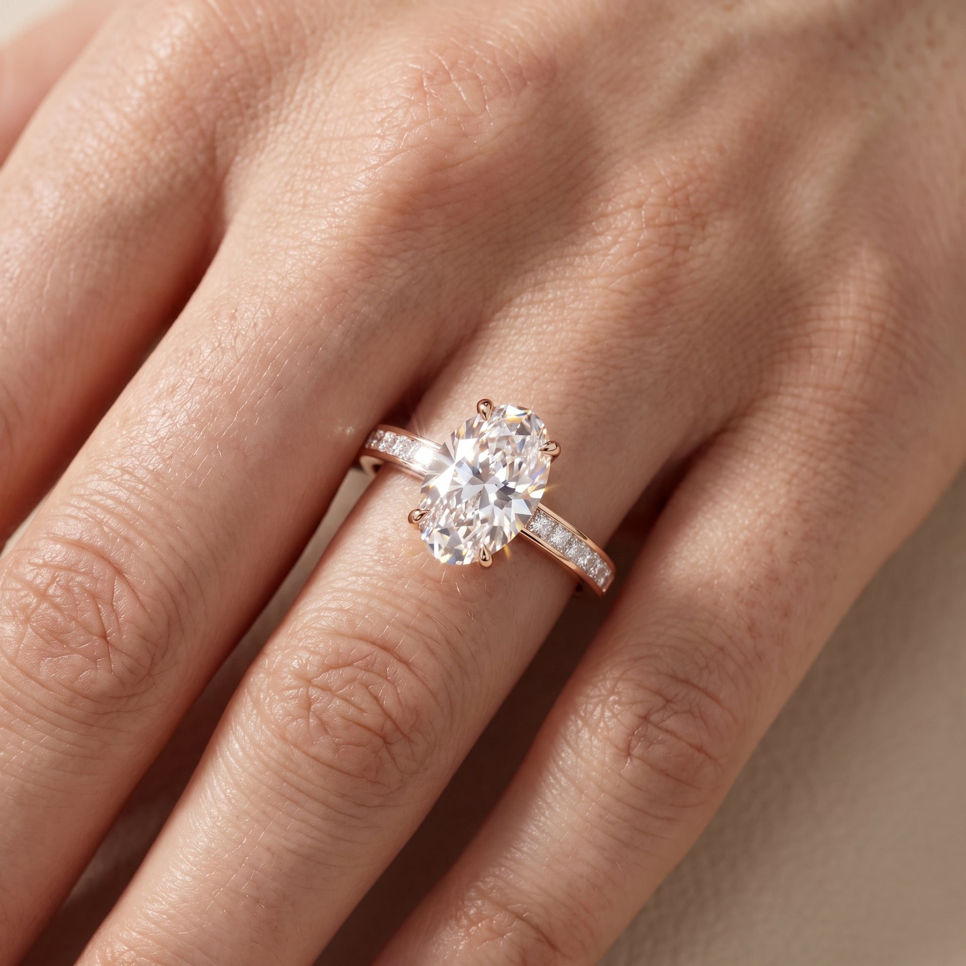 Maren Sidestone Channel Set Oval Diamond Engagement Ring in Rose Gold - lifestyle.jpg