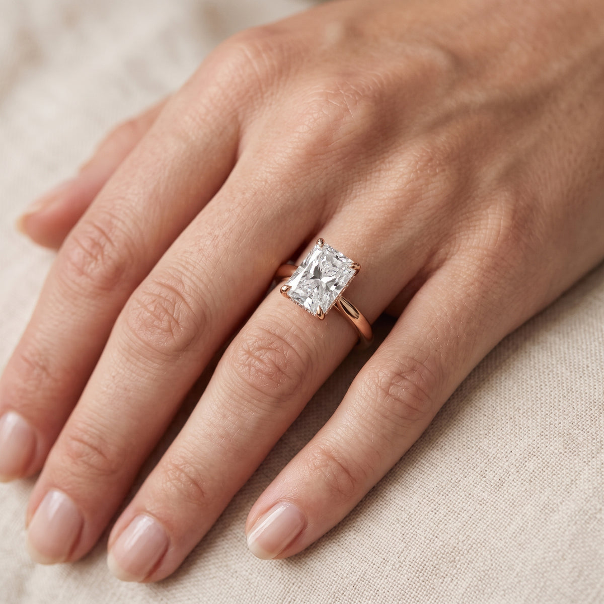 Mena Hidden Halo Radiant Diamond Engagement Ring in Rose Gold - lifestyle.jpg