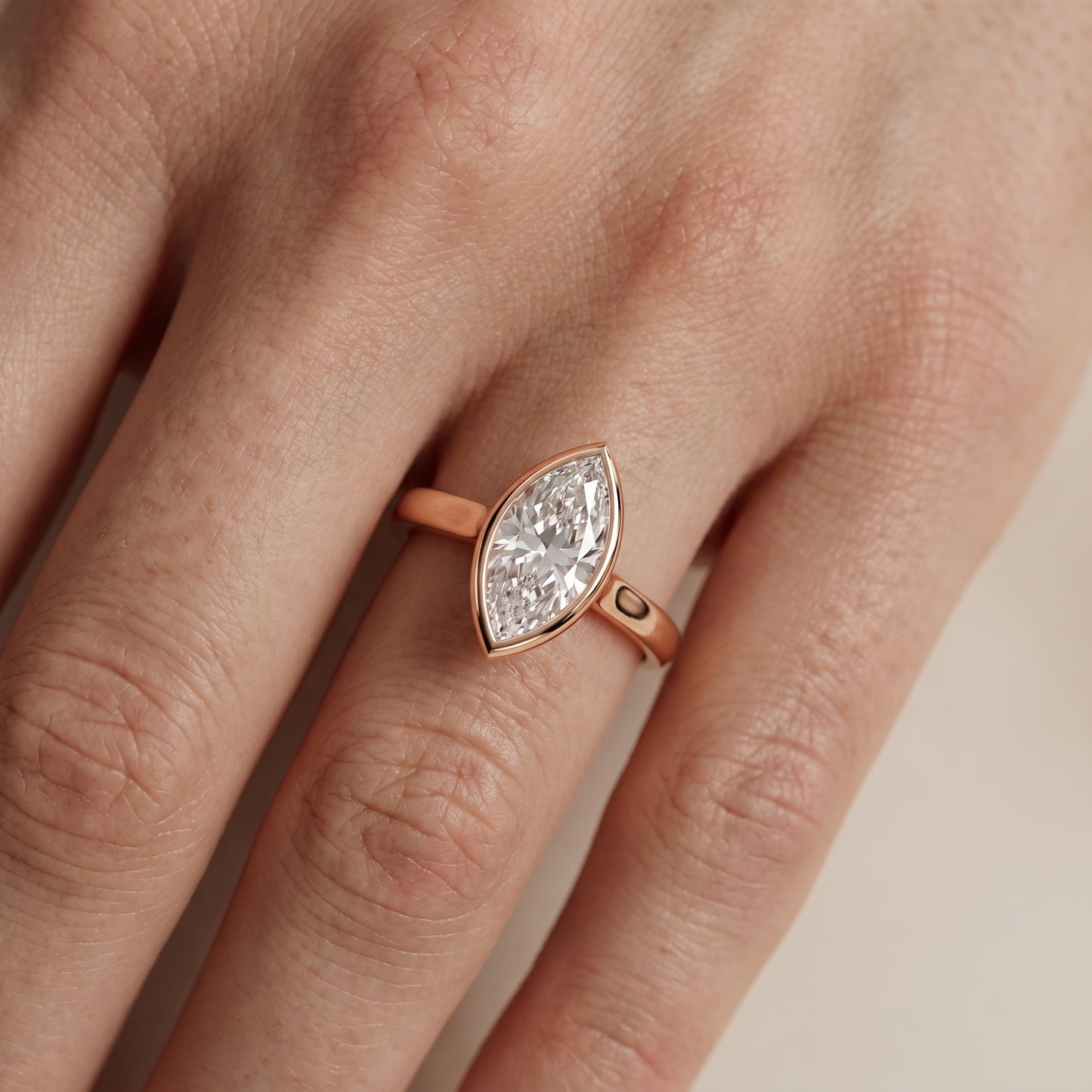 Jolie Bezel Solitaire Marquise Diamond Engagement Ring in Rose Gold - lifestyle.jpg