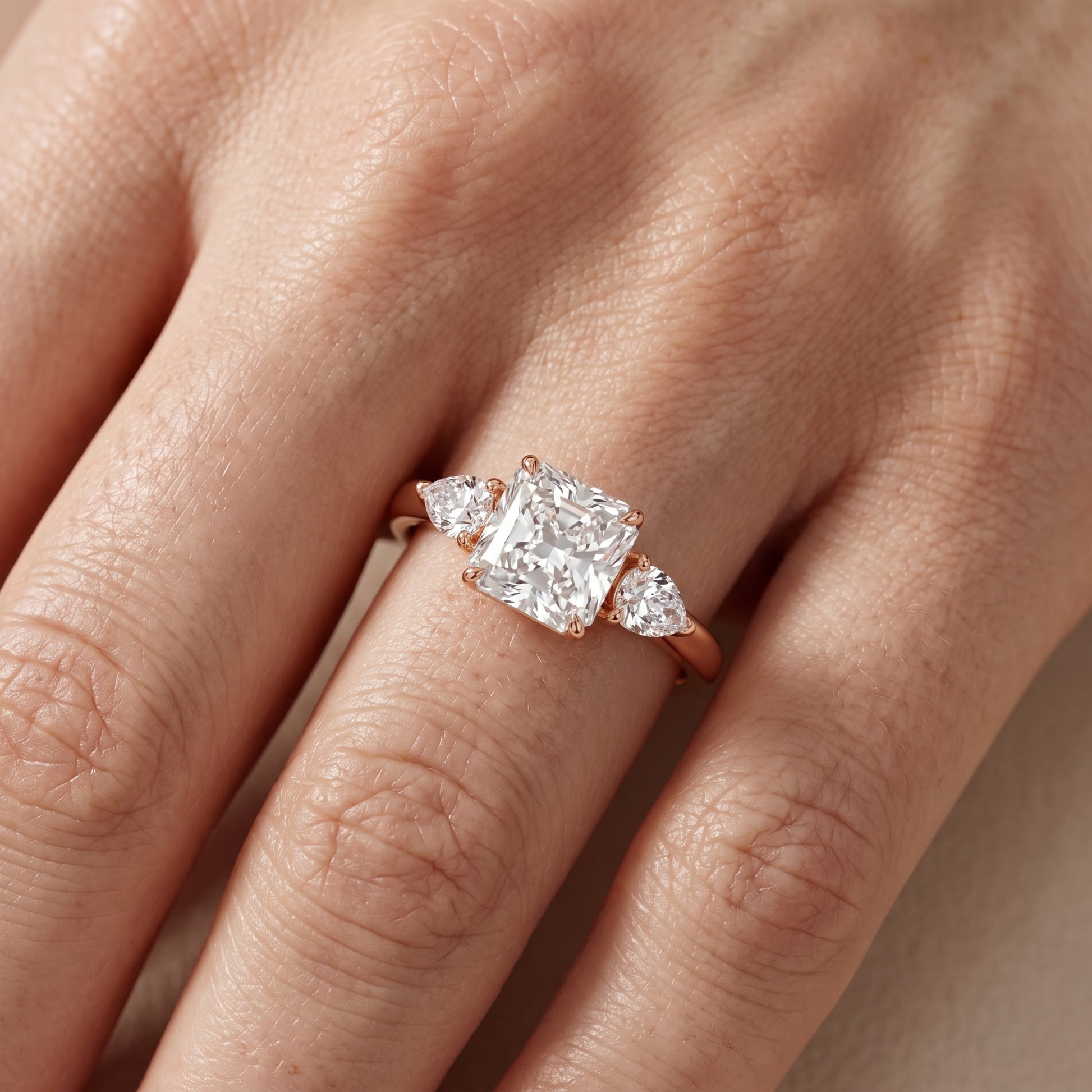 Phoebe Three-Stone Radiant Diamond Ring in Rose Gold - lifestyle.jpg