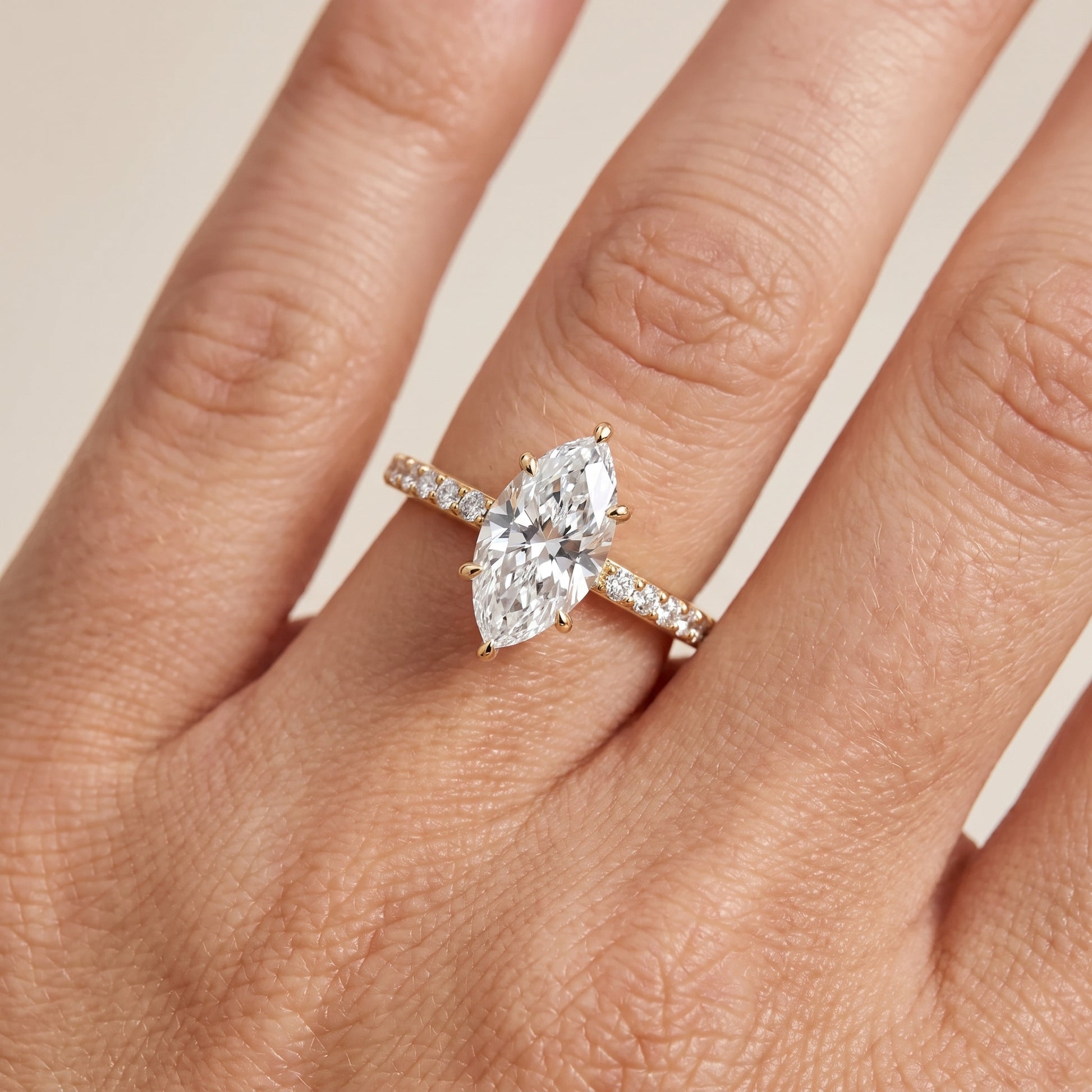 Aisha Pavé Solitaire Marquise Diamond Engagement Ring in Yellow Gold - lifestyle.jpg